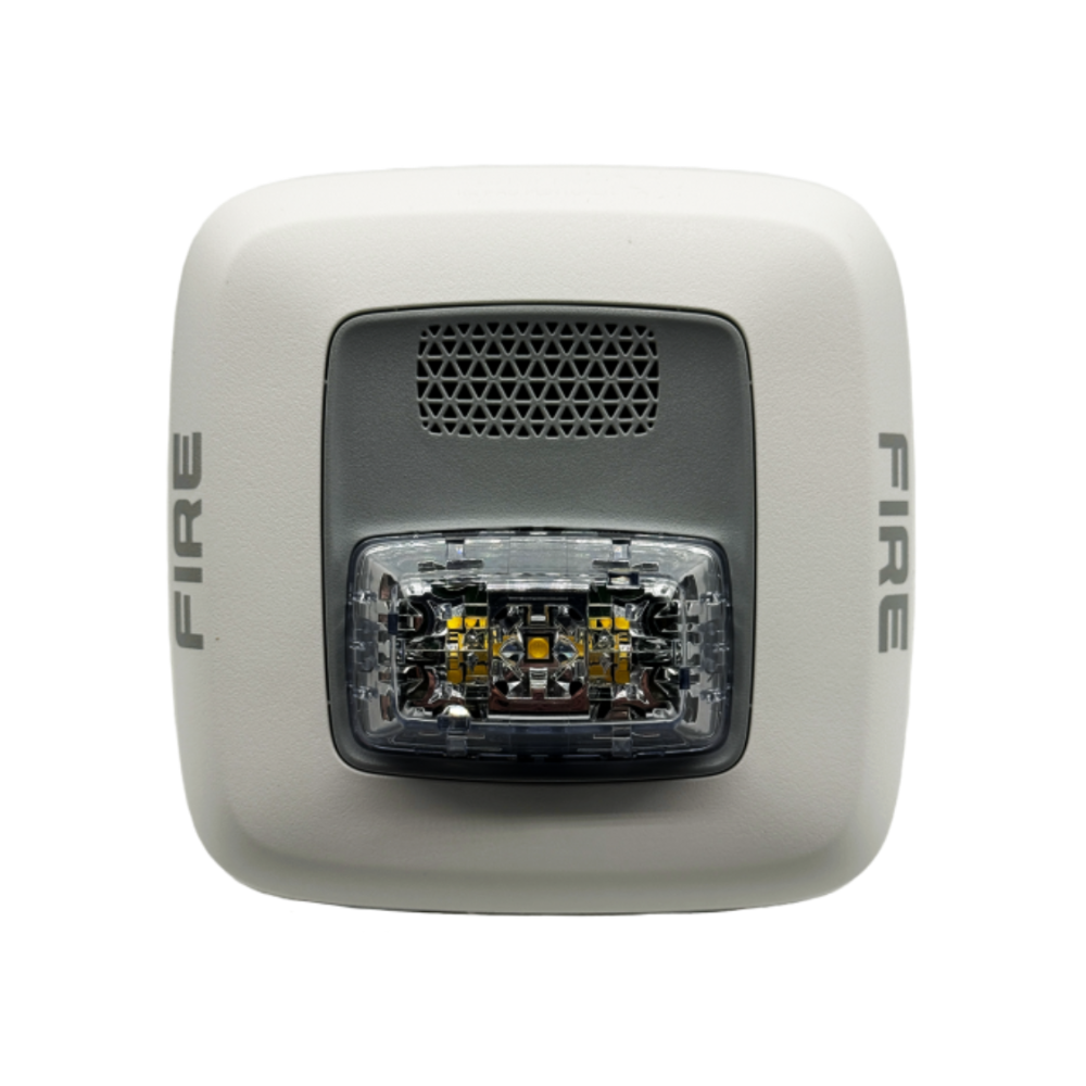 Gentex GHSW fire alarm with smoke and heat detection, mounted on wall, designed for early fire warning safety systems