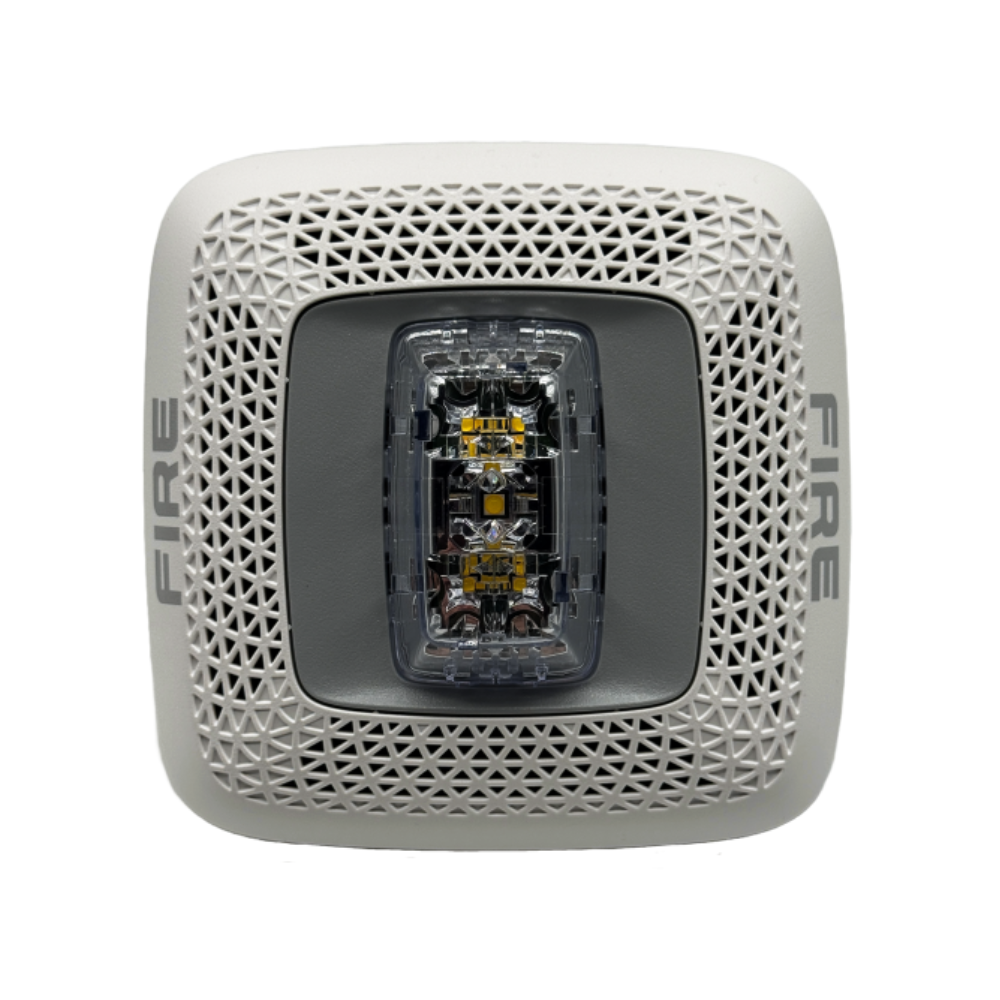 Gentex GSSW fire alarm sensor with system sensor ULC-ZNAC-PS certification, mounted on a wall in a building safety system.