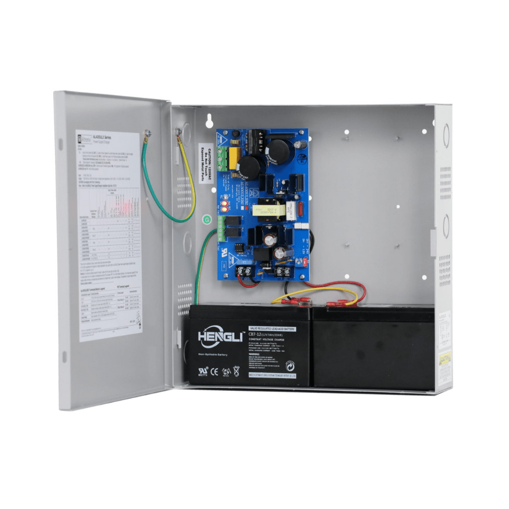 Altronix AL400ULX fire alarm system sensor with ULC certification, mounted on a wall with wiring visible.