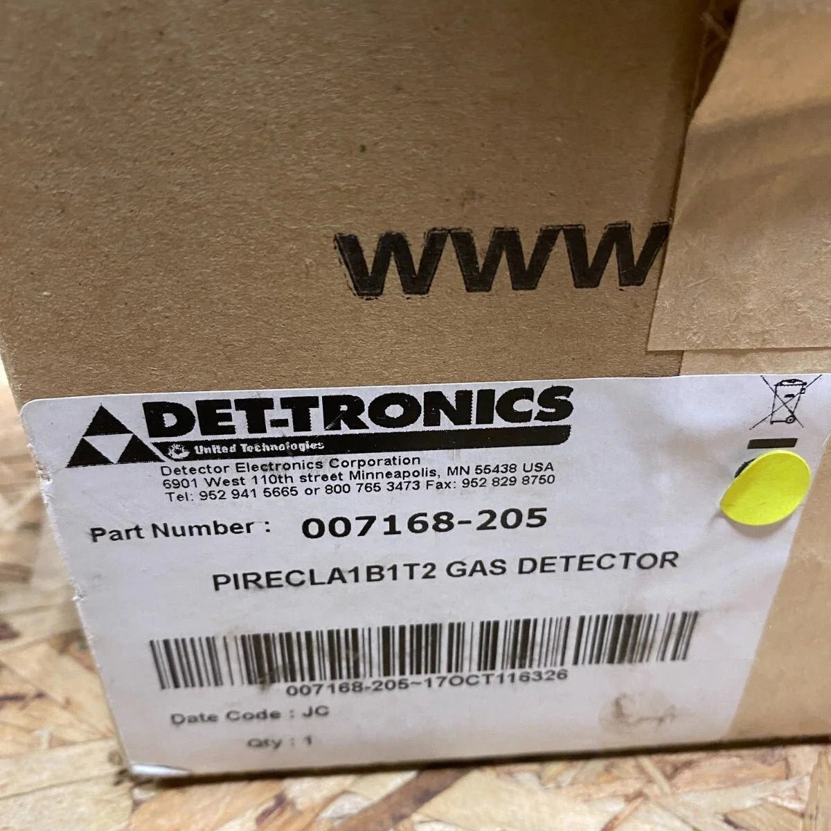 Det-Tronics fire alarm model 007168-205 with alert indicator and control panel, mounted on a wall in a safety system setup.