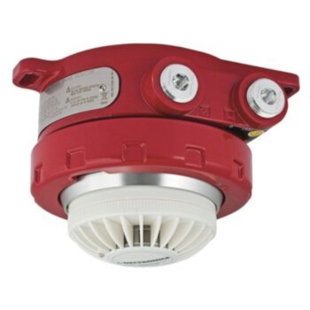 Det-Tronics 012500-204 safety sensor with black and white components, mounted on a industrial control panel or device.