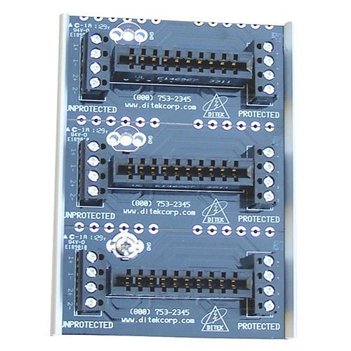 Ditek DTK-3MB surge protection device mounted on a circuit panel with wiring connections visible.