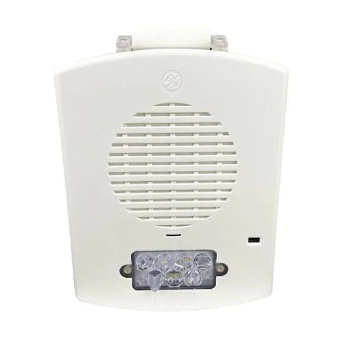 Eaton Wheelock EL3RSPST-FW emergency alarm switch with red button and black housing, mounted on a white panel.