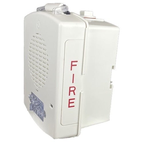 Eaton Wheelock EL4XHS-FW fire alarm strobe light with clear lens, mounted on a white ceiling.