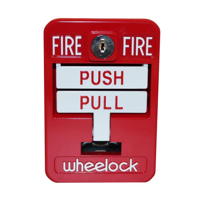 Eaton Wheelock MPS-200 fire alarm control panel with indicator lights and control buttons, mounted on a wall.