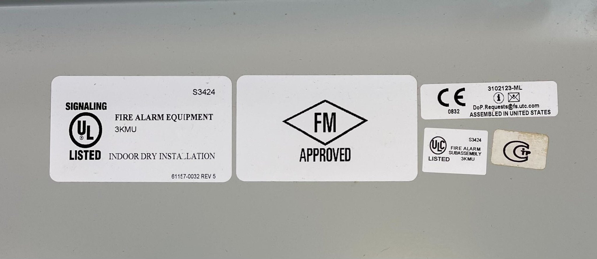 Edwards 10ANN/B-S fire alarm with yellow cover and mounting bracket, designed for fire detection and safety systems.