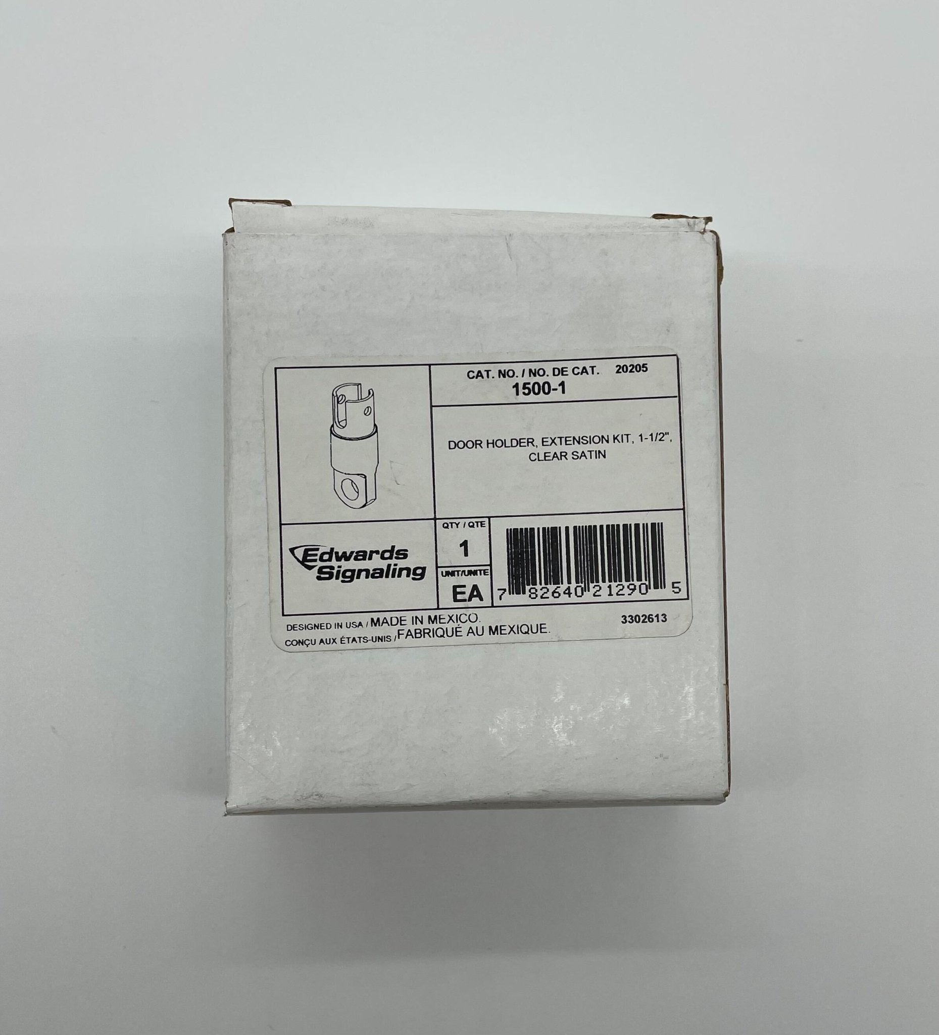 Edwards 1500-1 door holder mounted on door frame, made of metal with a sleek finish, designed to secure doors in open position.
