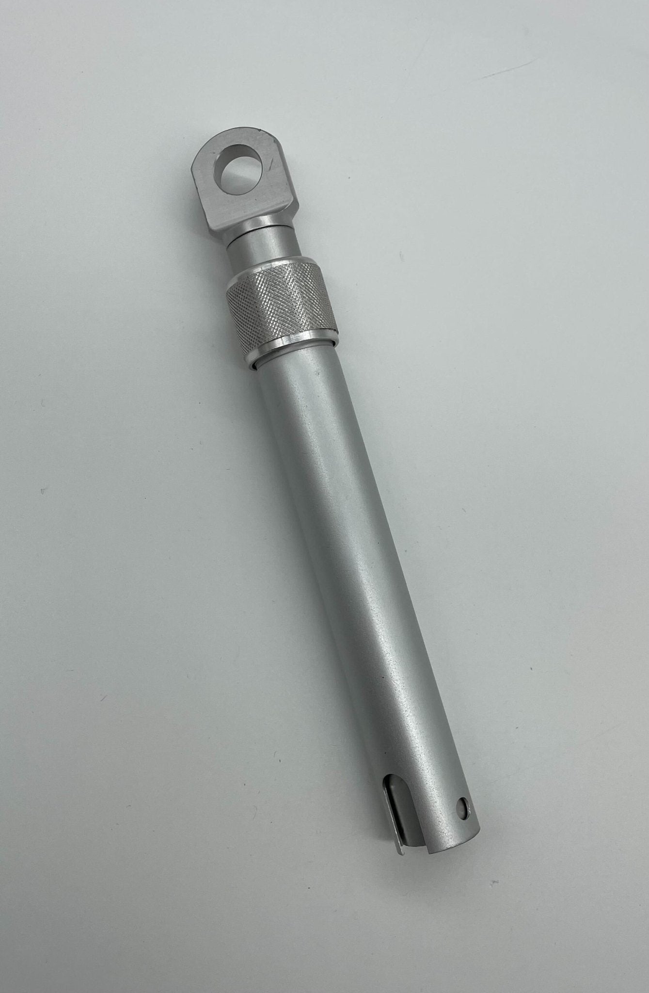 Edwards 1500-12 door holder mounted on wall, made of durable metal, designed to keep doors open securely.