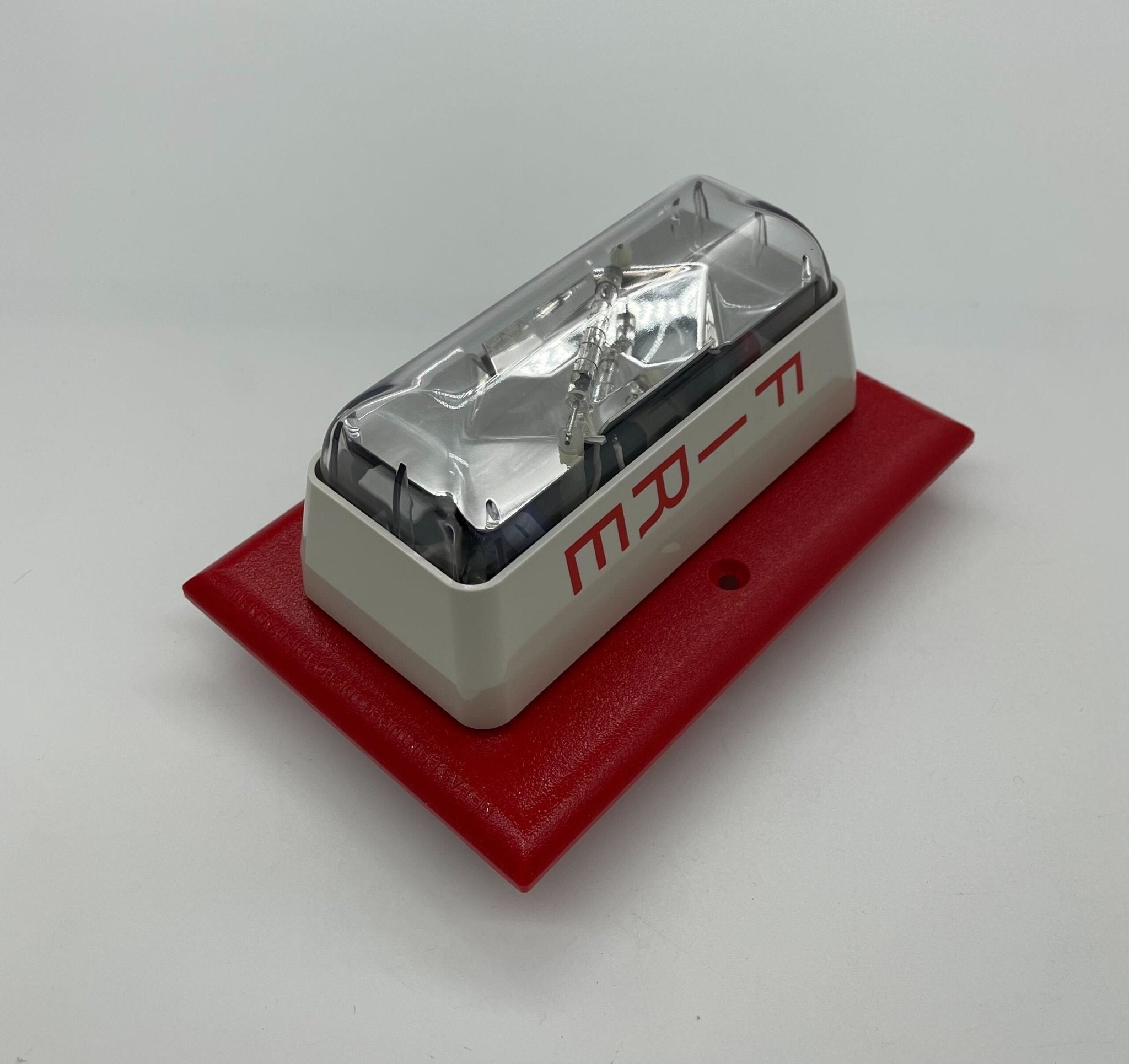 Edwards 203-8A-T strobe light with black housing and mounting bracket, designed for industrial lighting applications.