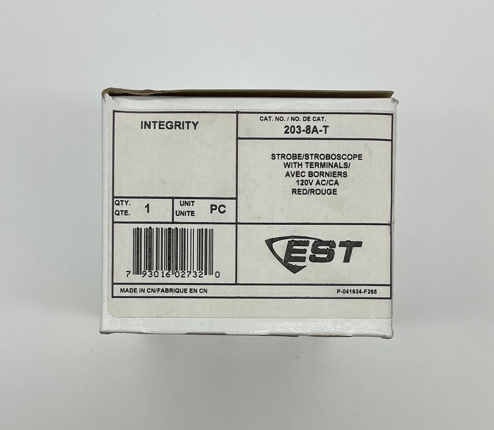 Edwards 203-8A-T strobe light with orange lens, mounted on a fixture, designed for industrial warning and signaling applications.