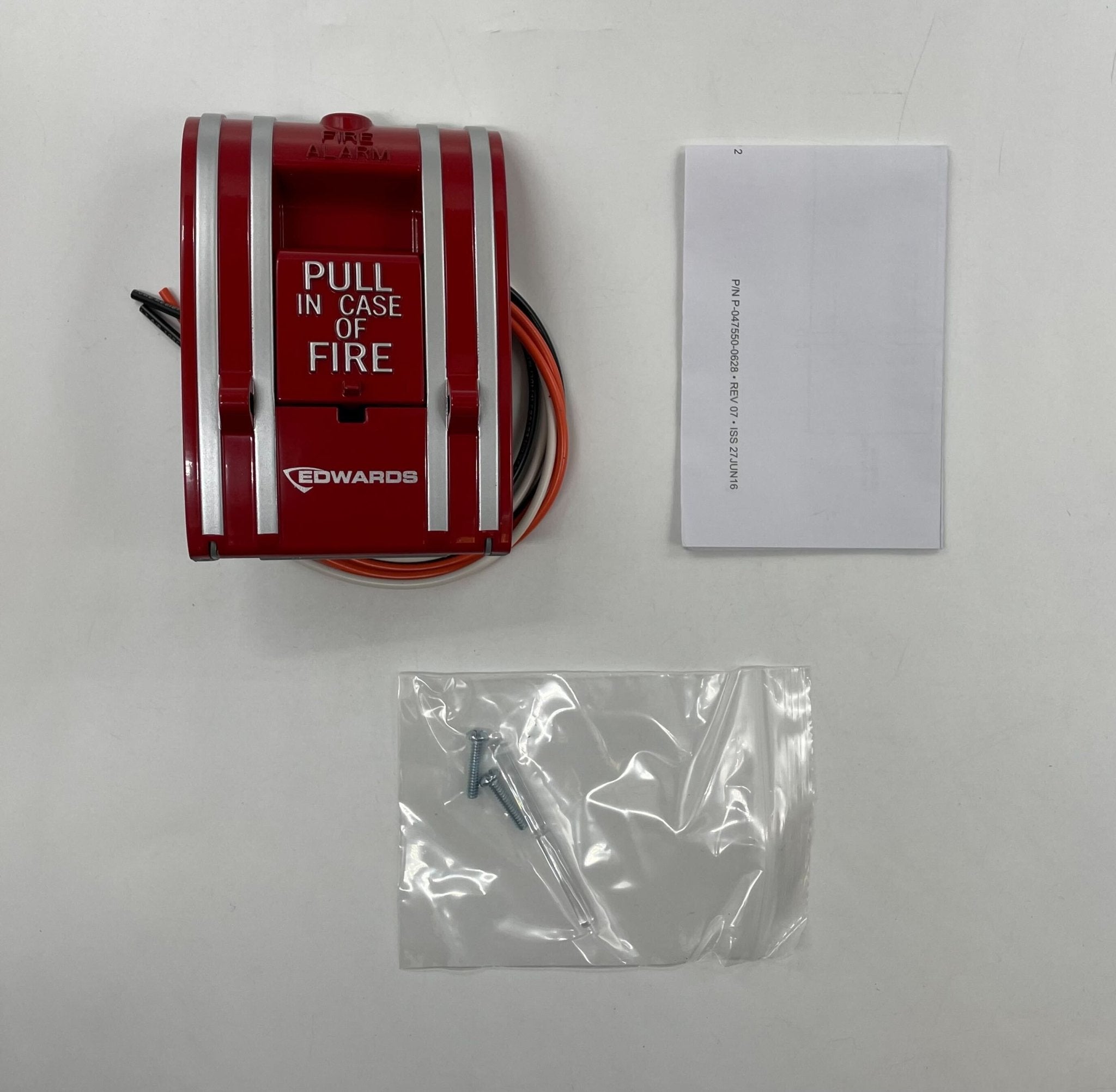 Edwards 270A-DPO pull station fire alarm switch mounted on a wall, with clear labeling and emergency activation handle.
