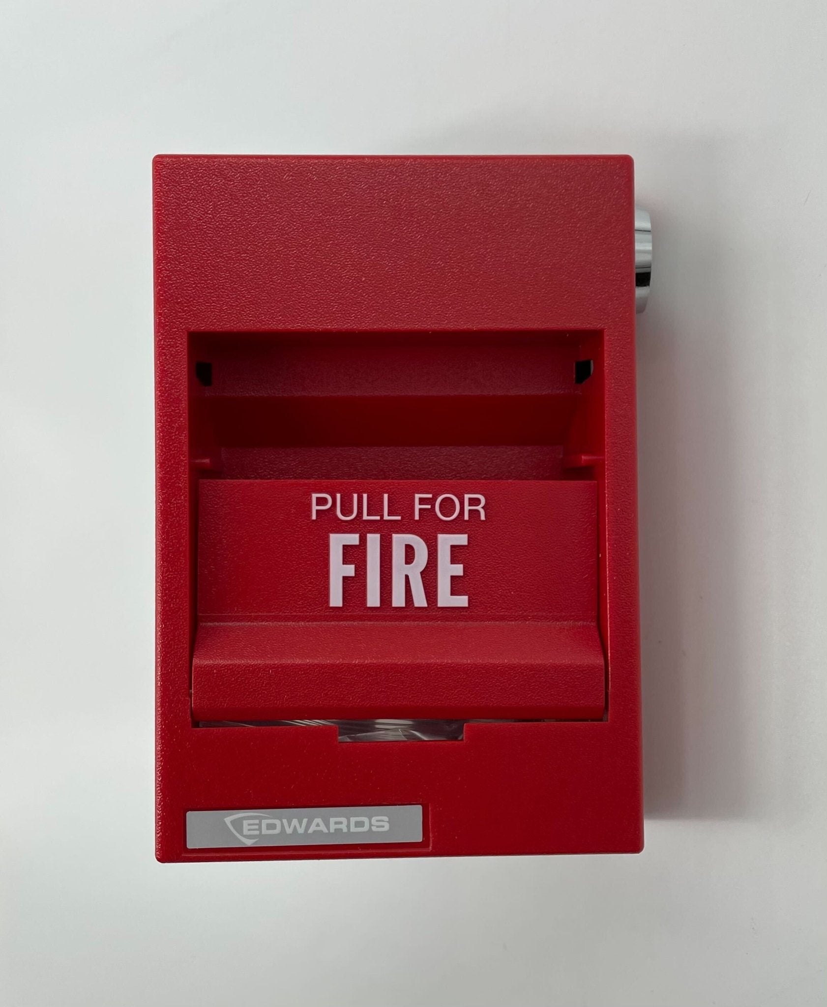 Edwards 276B-1120 pull station fire alarm switch mounted on wall, used for emergency fire alert systems.