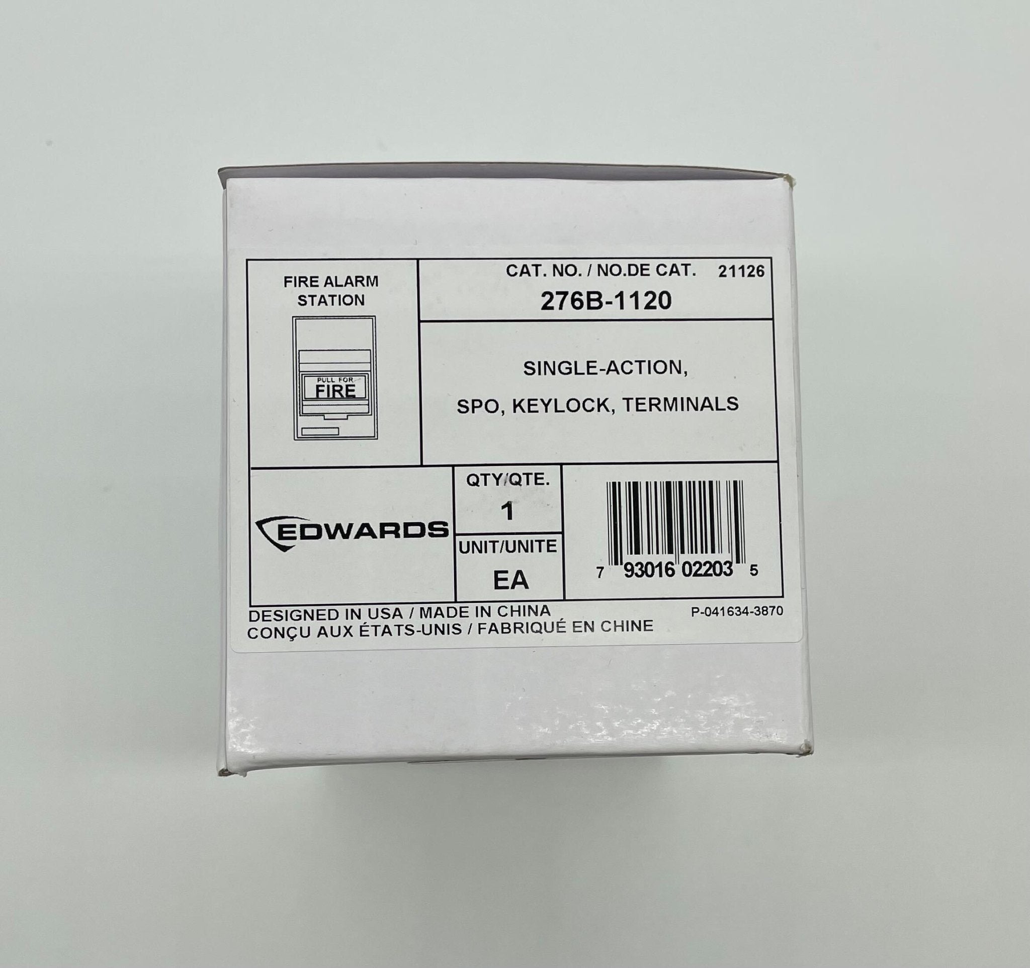 Edwards 276B-1120 pull station fire alarm device mounted on a wall with visible buttons and indicator light.