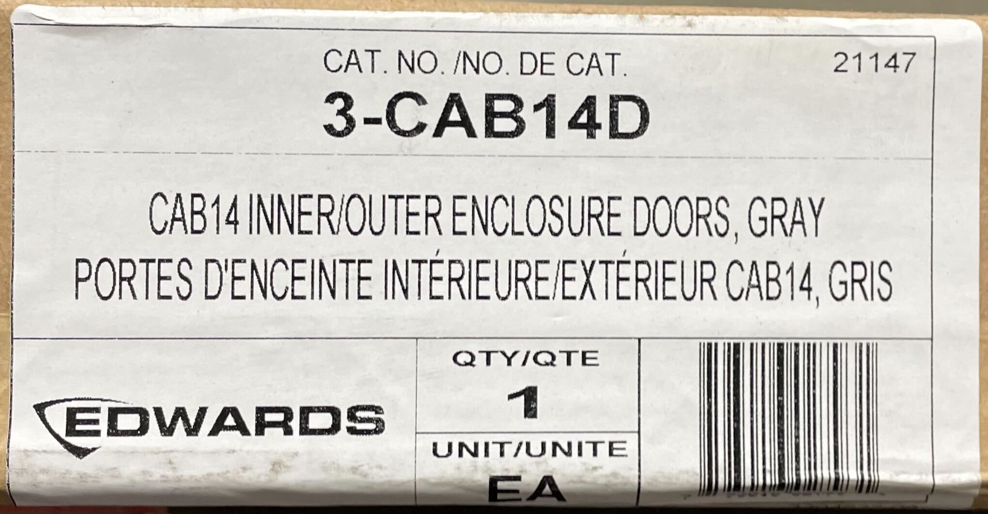 Edwards 3-CAB14D fire alarm detector mounted on ceiling in a building.