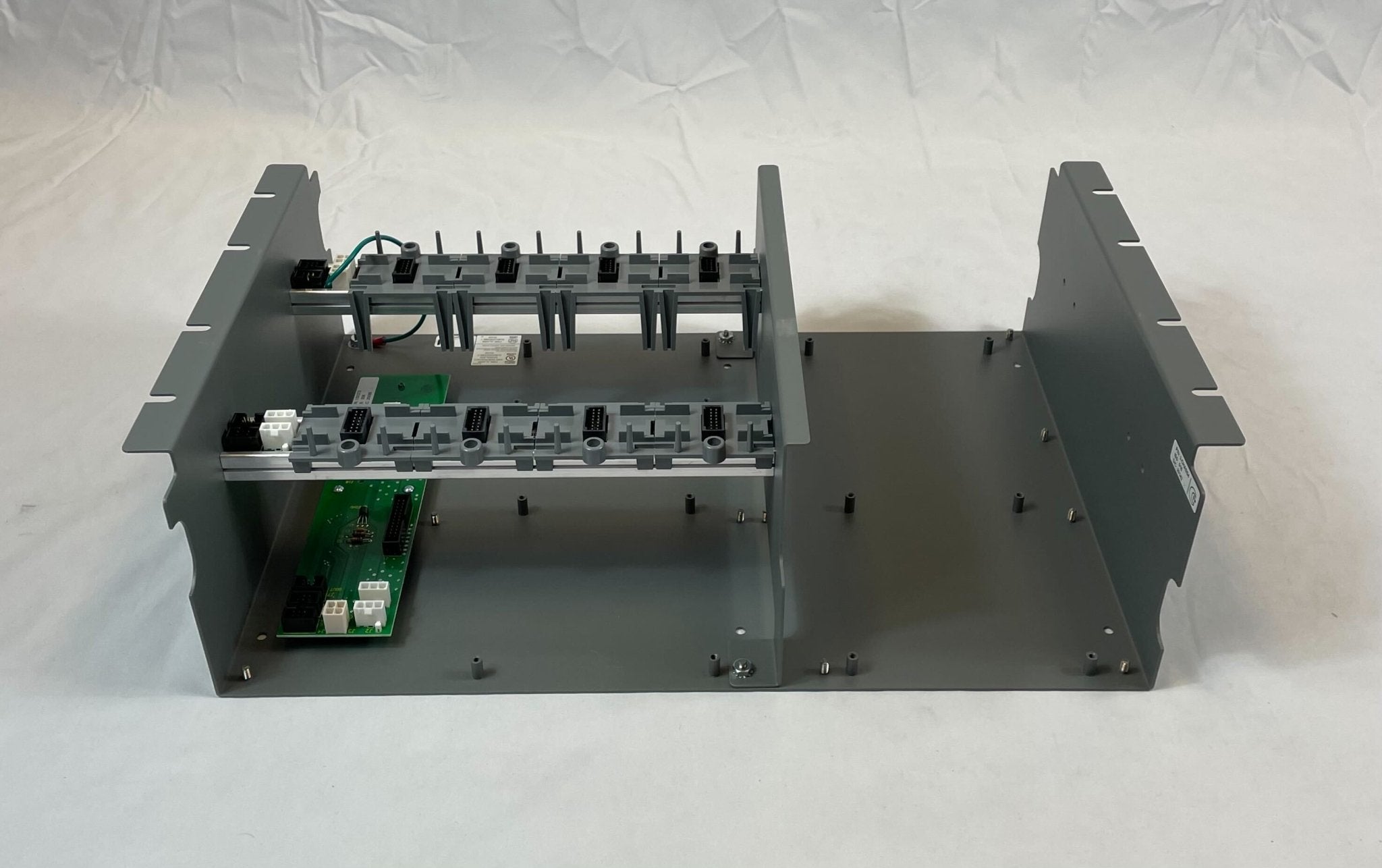 Edwards 3-CHASS4 chassis by Edwards, shown in black with mounting holes and structural frame for industrial systems.
