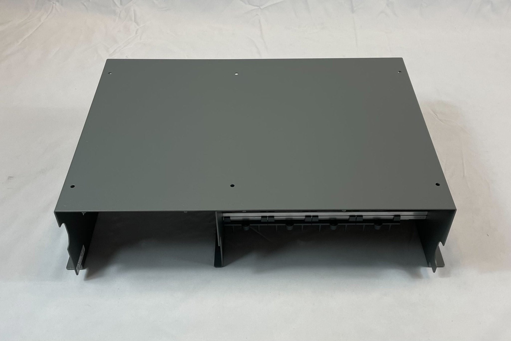 Edwards 3-CHASS4 chassis, a sturdy metal frame for industrial equipment, shown in a close-up image.