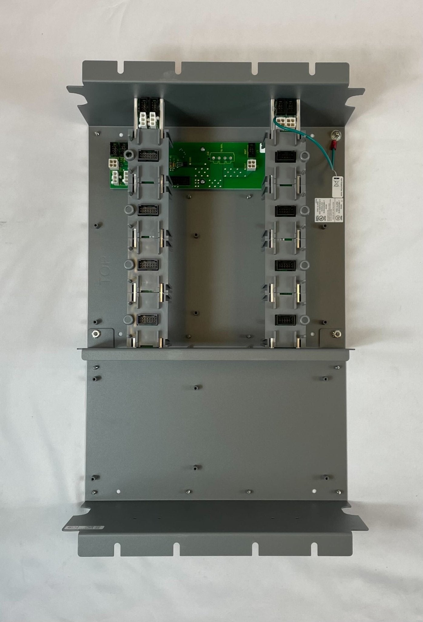 Edwards 3-CHASS4 chassis by Edwards, shown in metal with mounting points and electronic components for industrial use.