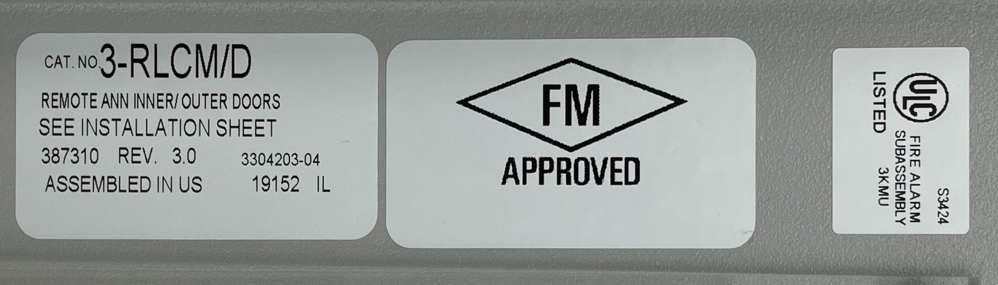 Edwards 3-RLCM/D fire alarm with alarm indicator and control panel, mounted on white wall for safety detection.