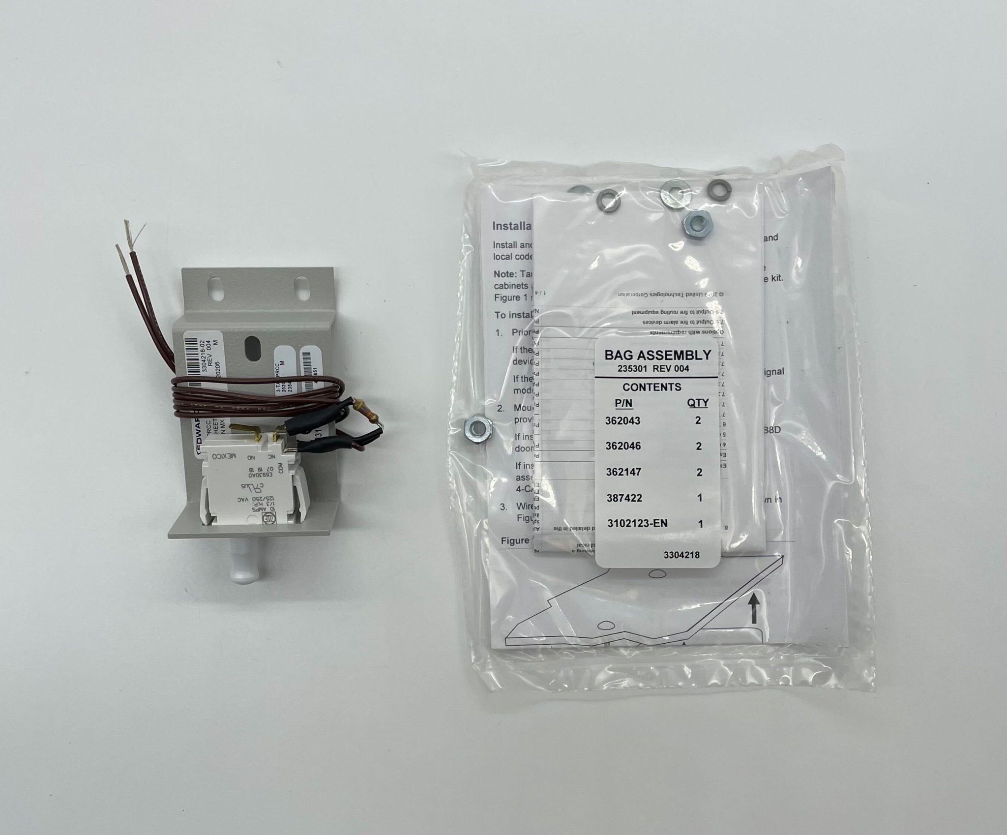 Edwards 3-TAMPRCC fire alarm with manual reset button and test switch, mounted on a white wall for safety monitoring