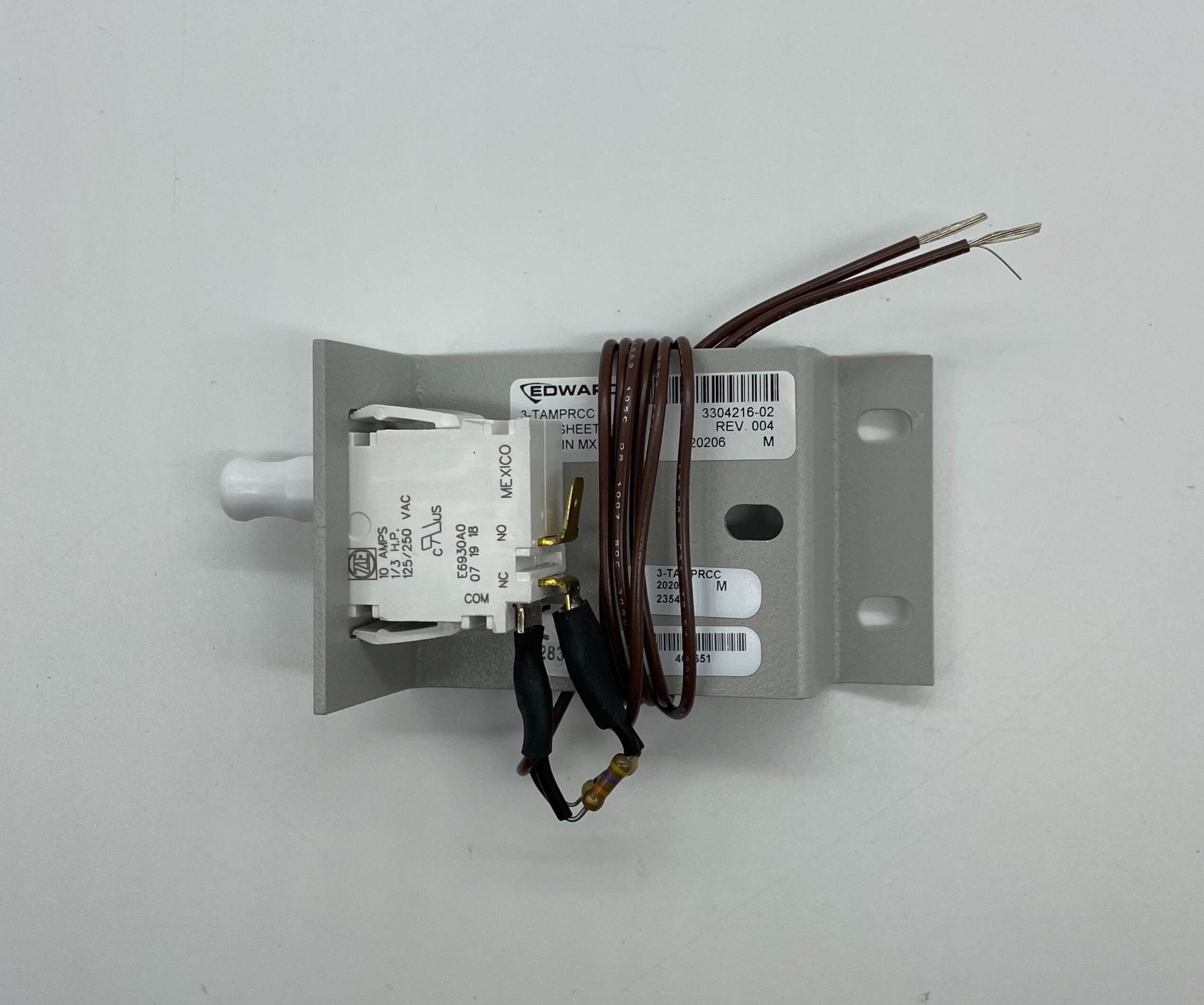 Edwards 3-TAMPRCC fire alarm with digital display and alarm indicator, mounted on wall for safety monitoring.