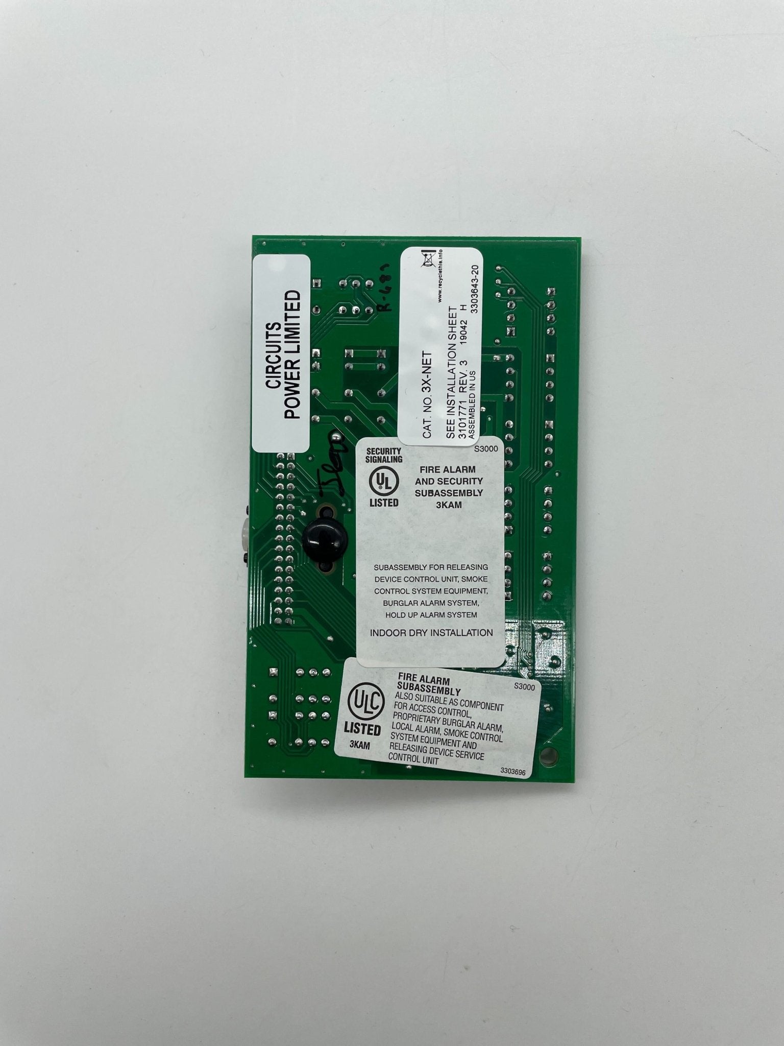 Edwards 3X-NET network card by Edwards, showing a close-up of the black circuit board with connector ports and branding details.
