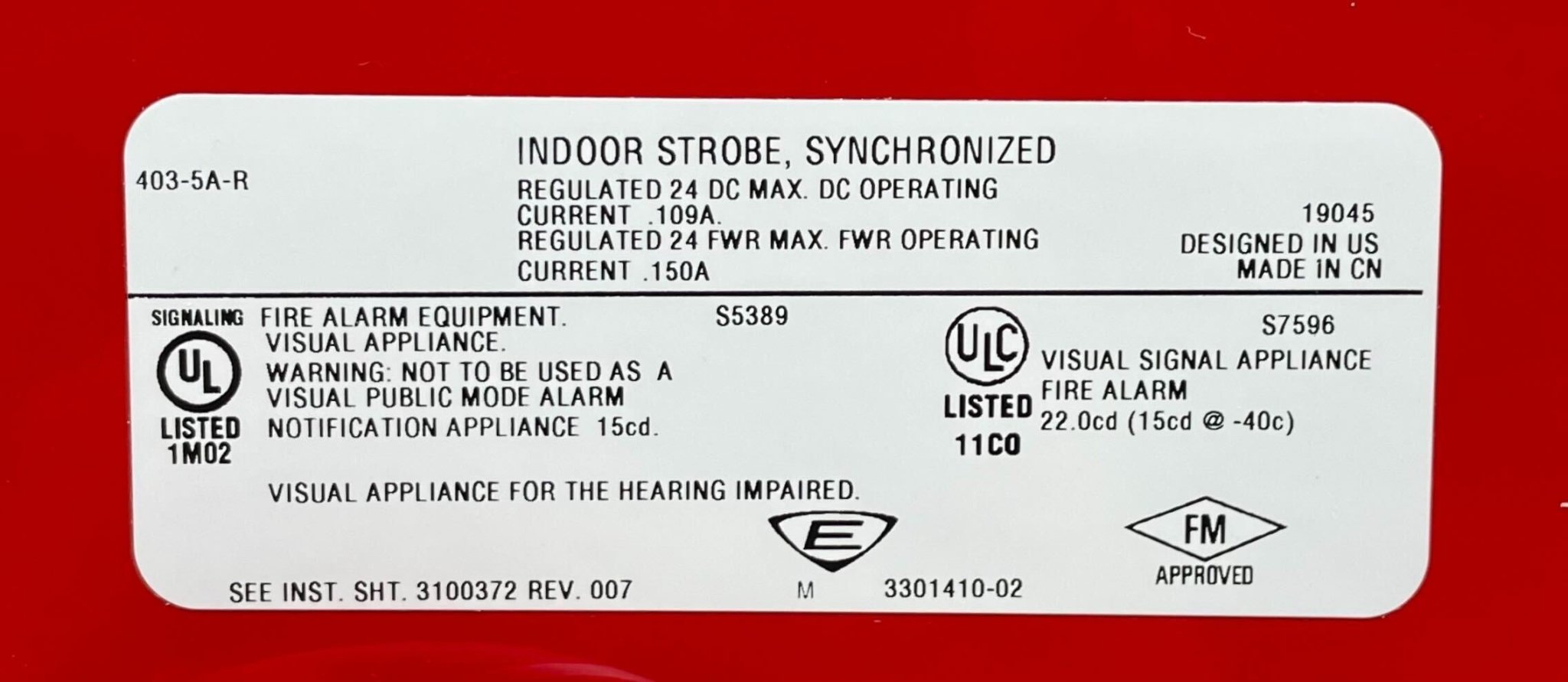 Edwards 403-5A-R strobe light with red lens, mounted on a ceiling, used for fire alarm signaling and emergency notification.
