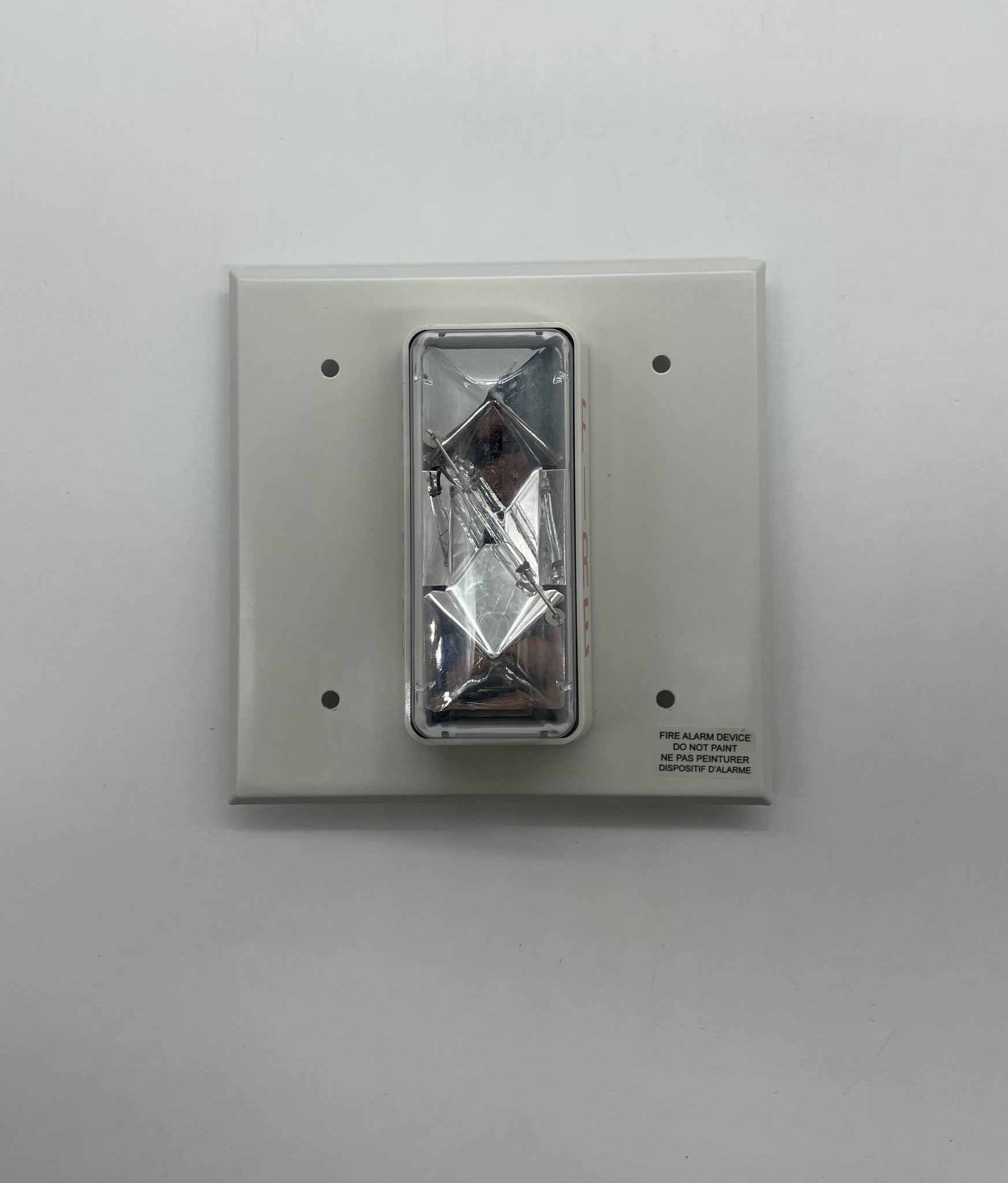 Edwards 405-7A-TW strobe light with Jem Systems Canada branding, mounted on a wall, showing its compact design and bright light.