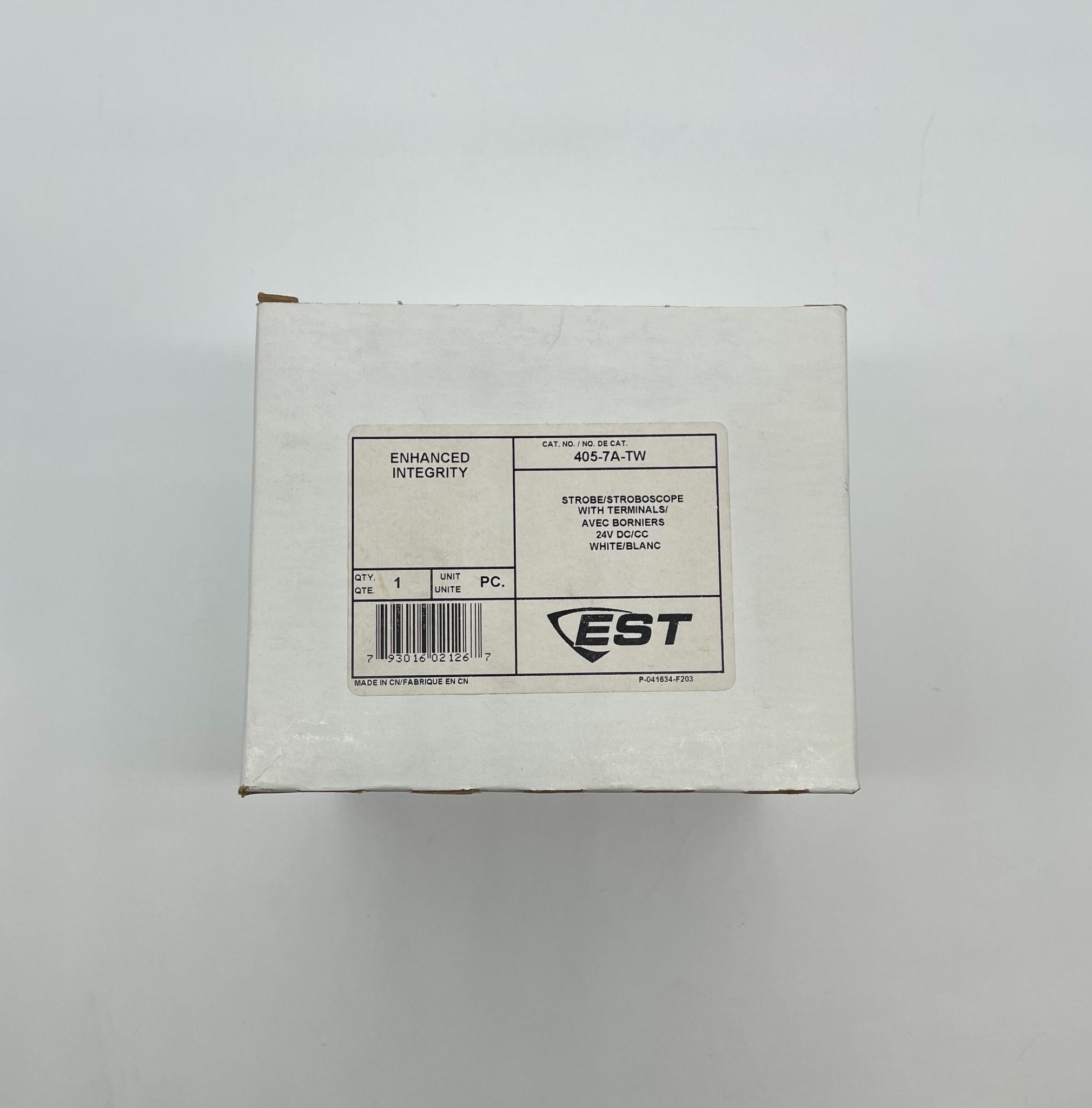 Edwards 405-7A-TW strobe light mounted on a system, with clear lens and wiring, used for industrial safety and signaling.