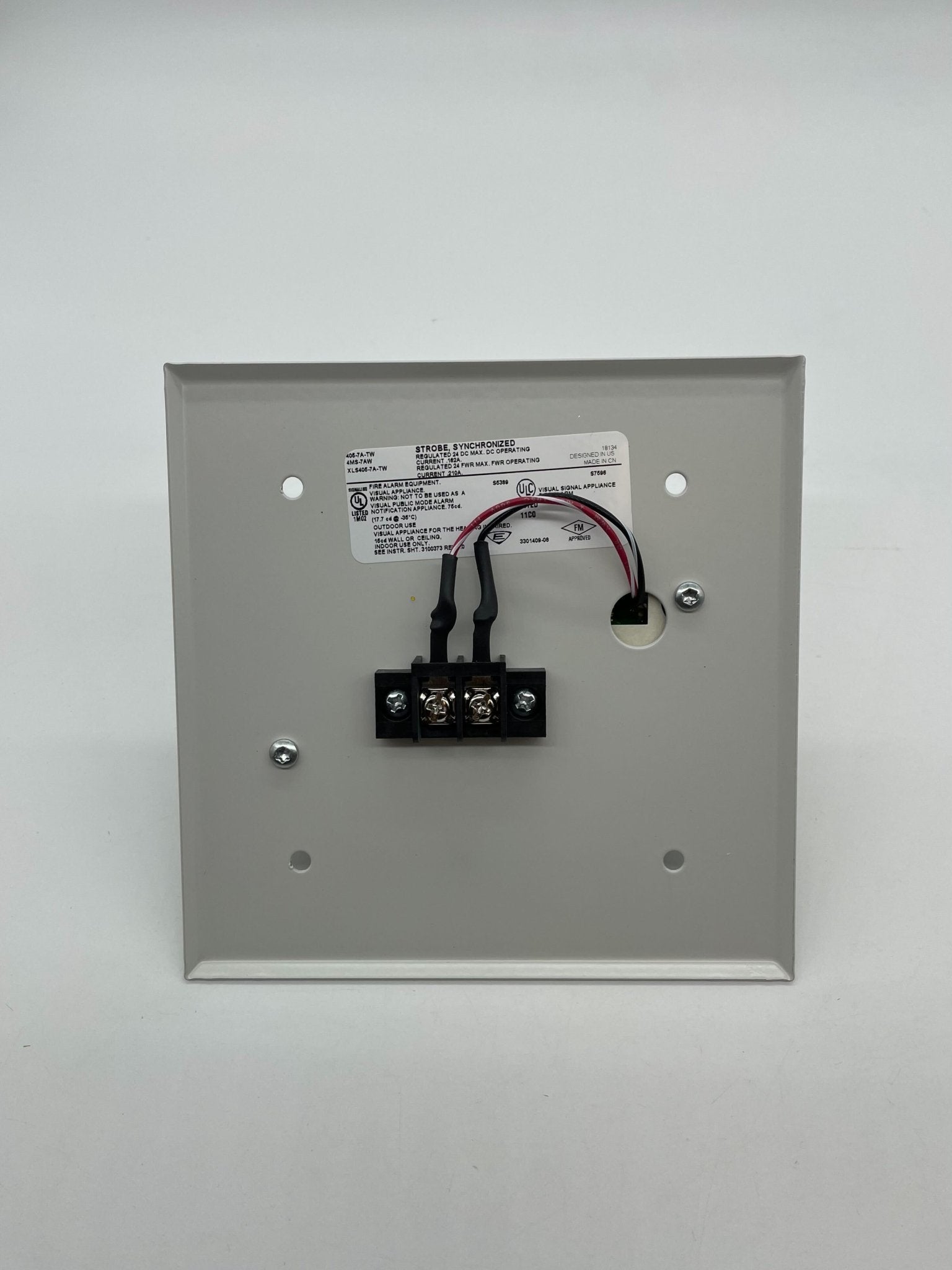Edwards 405-7A-TW strobe light with a sleek black design, mounted on a metal bracket for industrial or emergency lighting.