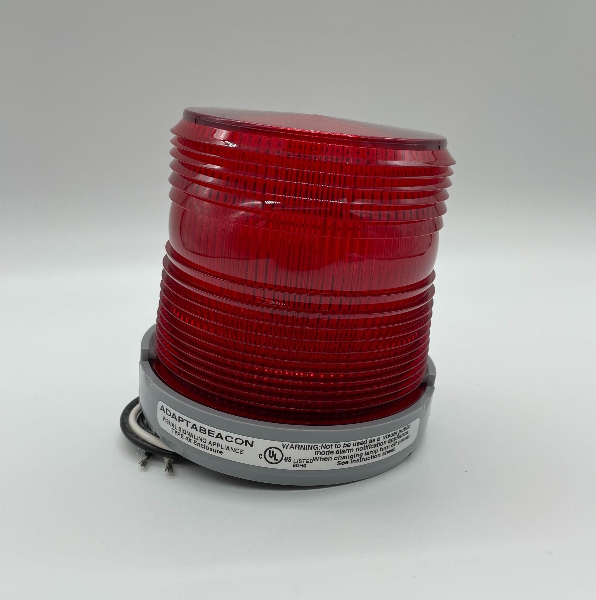 Edwards 48SINR-N5-25WH beacon with alert lens, mounted on a wall, featuring a white housing and clear lens for signaling.