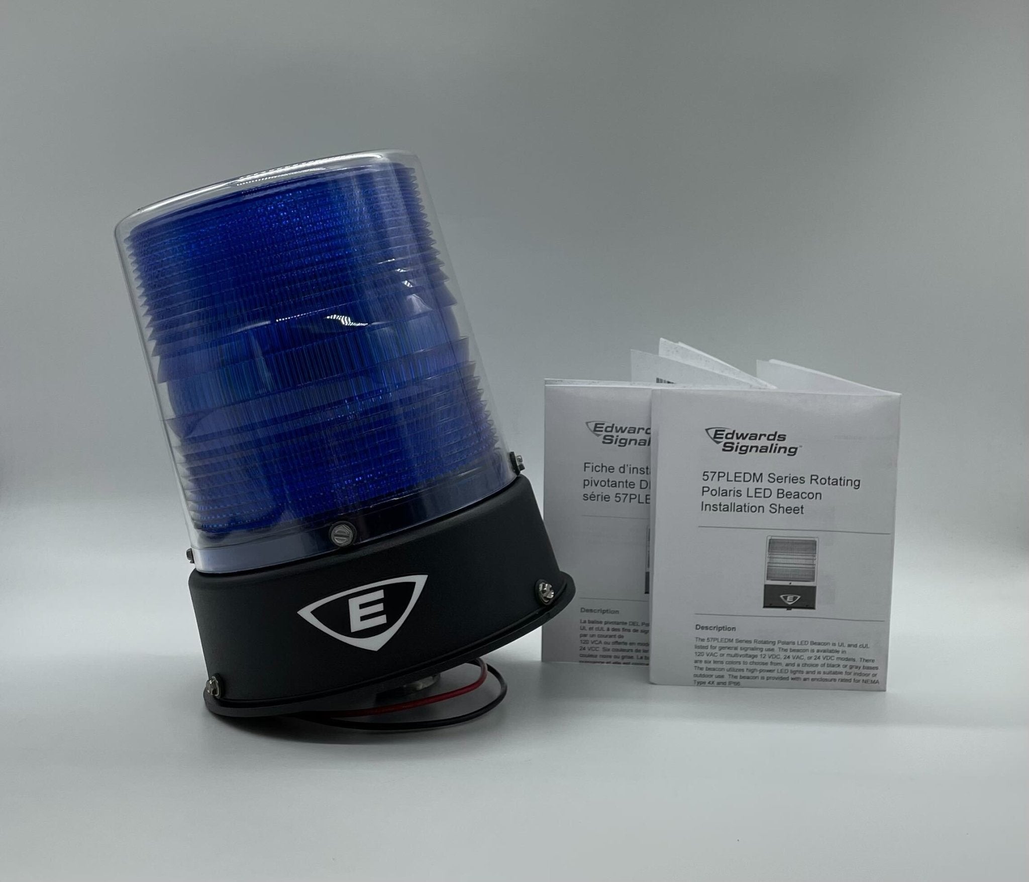 Edwards 57PLEDMB24ADB beacon with bright LED light, mounted on a wall for warning and signaling applications.
