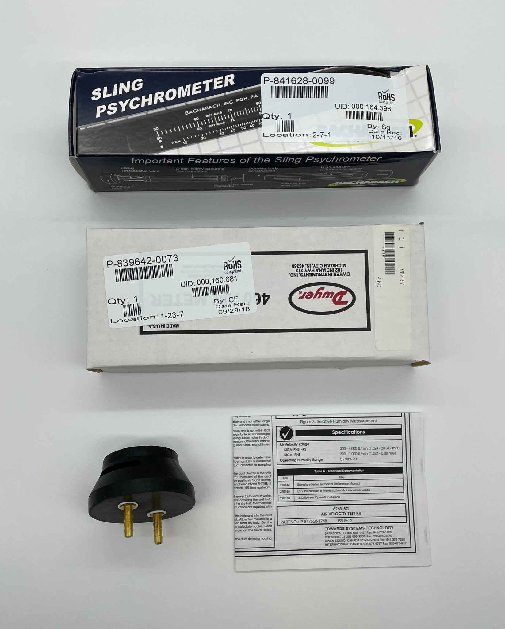 Edwards 6263-SG fire alarm with digital display and testing button, mounted on wall, in a commercial building setting.