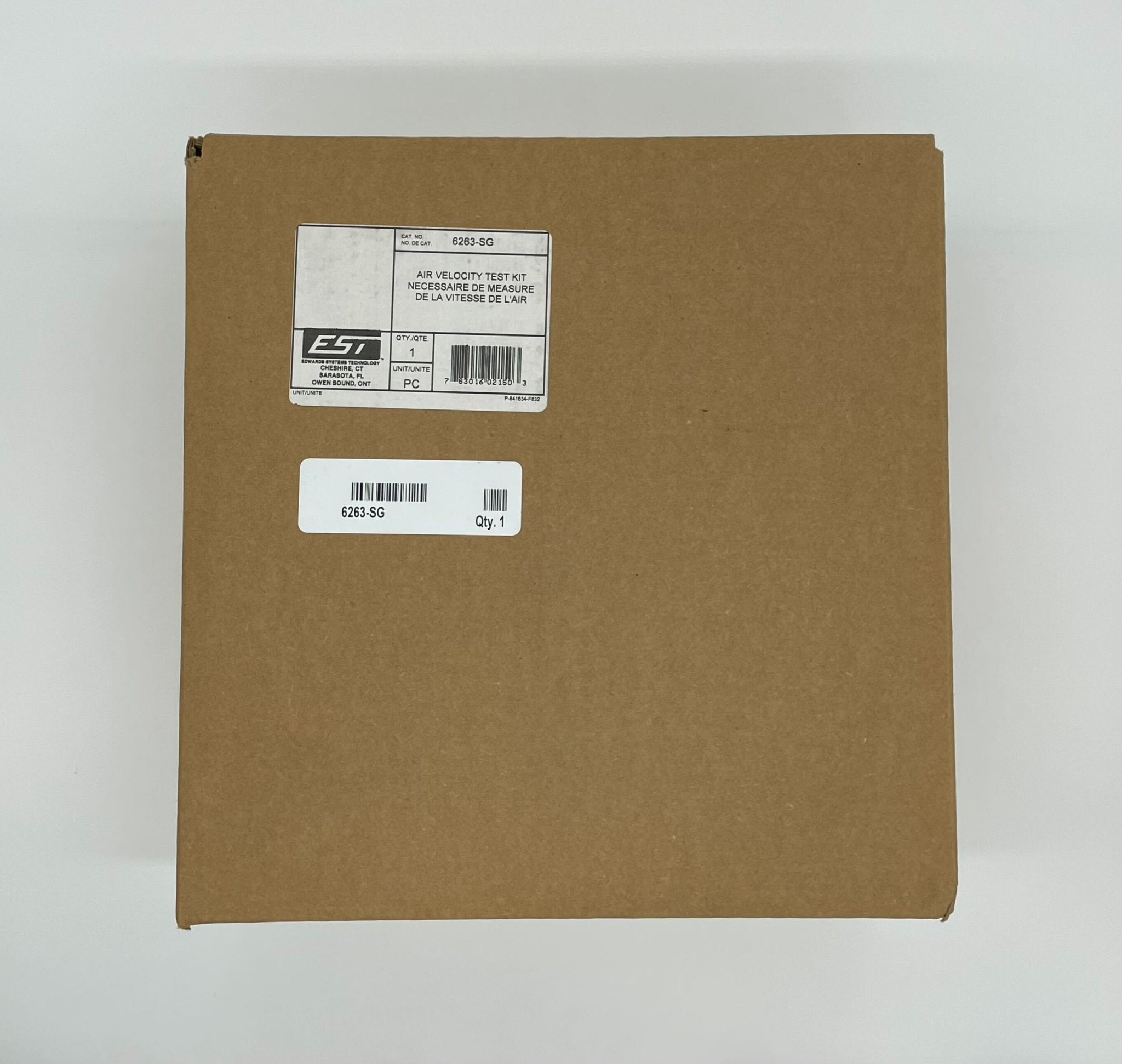 Edwards 6263-SG fire alarm with alarm horn and sensor, mounted on wall, used for building fire safety.