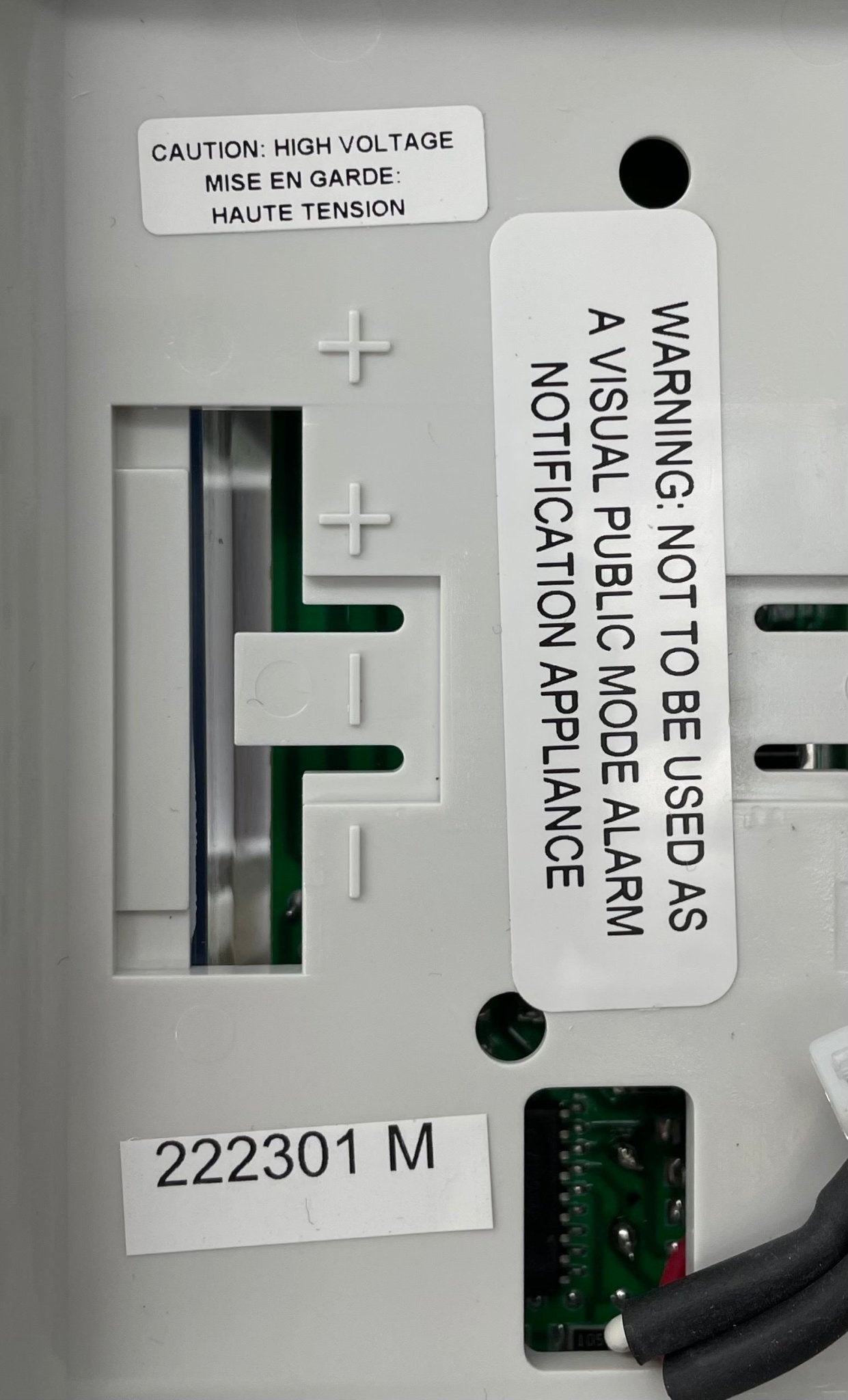 Edwards 7005-G5 fire alarm device with digital display and sensor, mounted on a wall for fire detection safety.