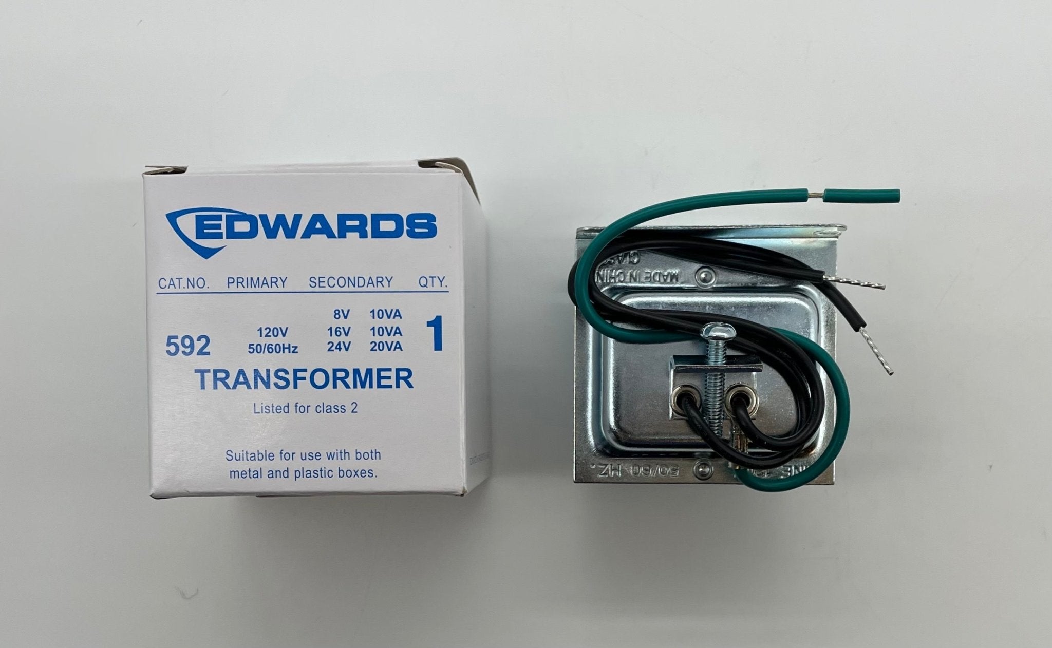 Edwards 7005-G5 fire alarm with Jem Systems Canada label, mounted on wall, featuring a white circular sensor and alarm indicator.