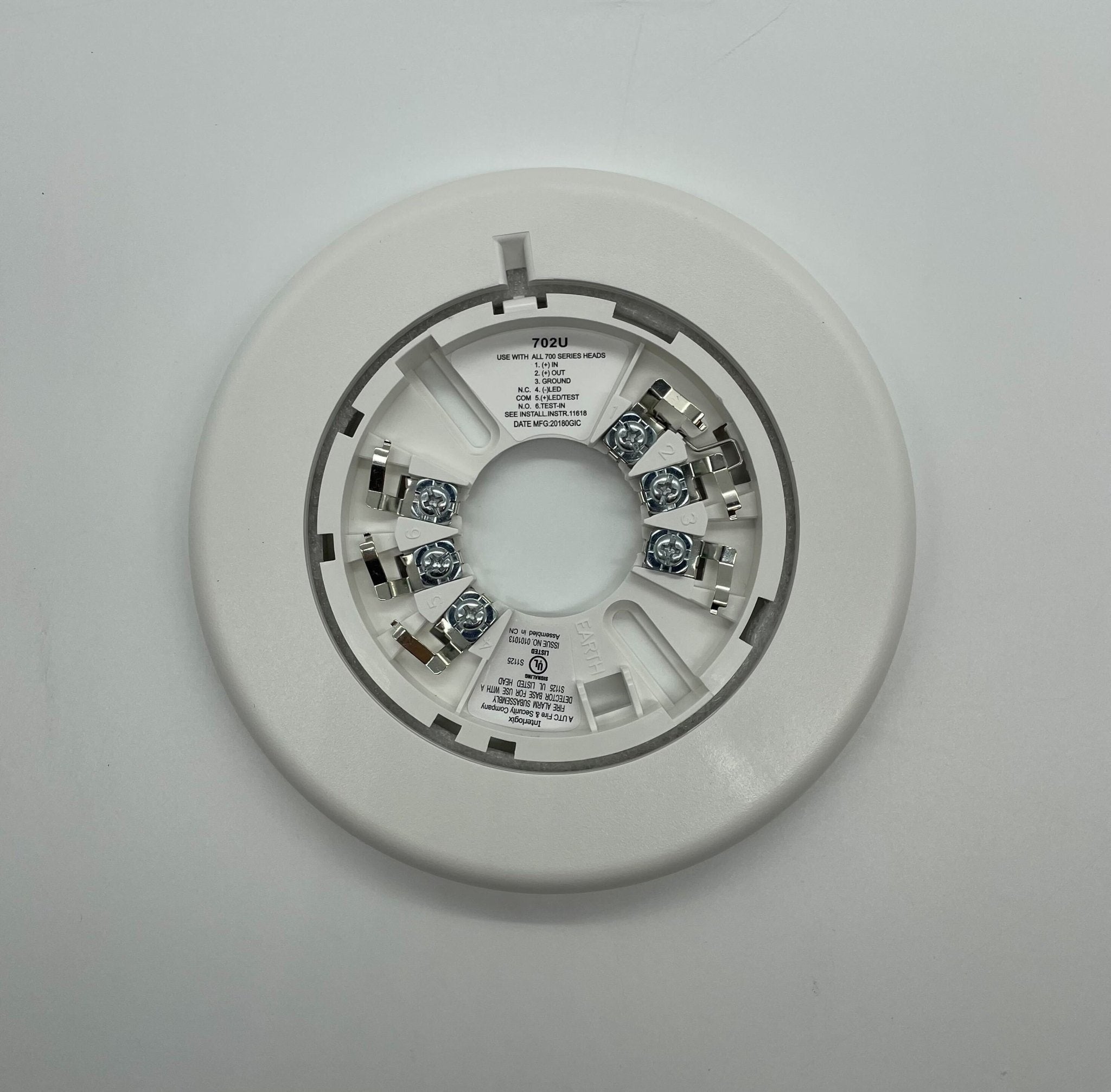 Edwards 702U Jem Systems Canada industrial valve with metal handle and pressure gauge, mounted on a metal surface.