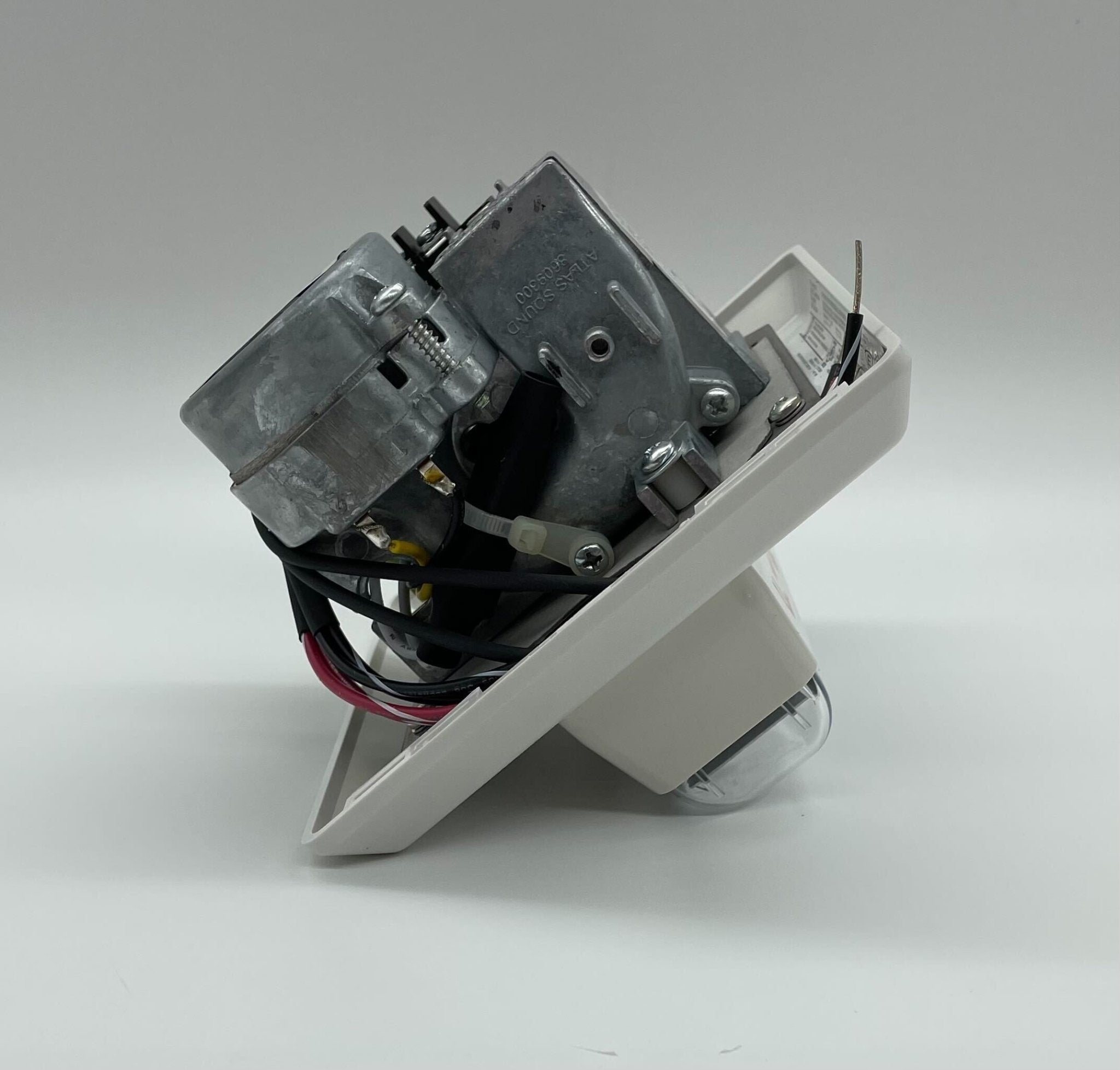 Edwards 757-3A-RS70W speaker strobe alarm with red and white design, mounted on a wall for emergency alert visibility.