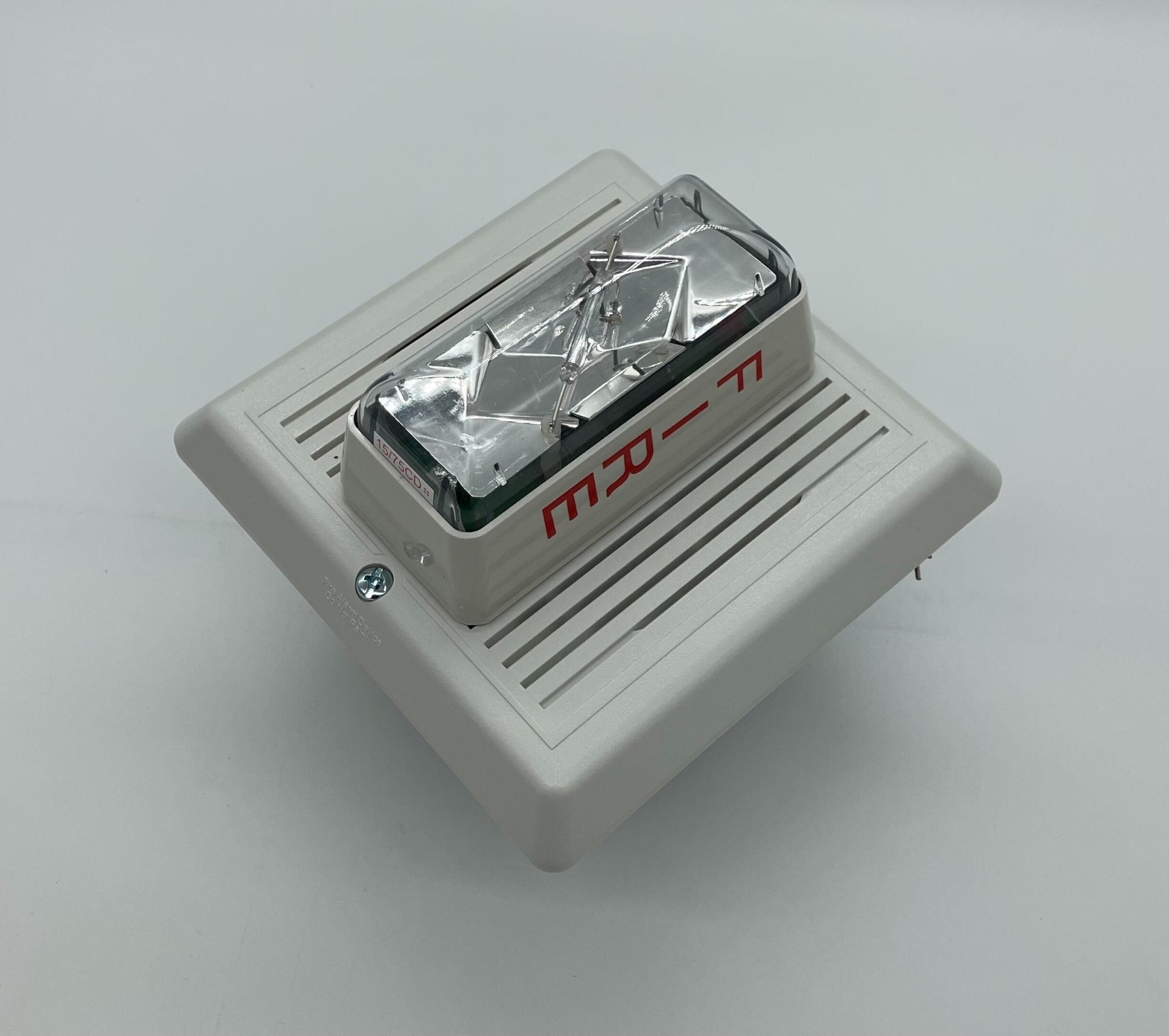 Edwards 757-7A-RS70W speaker strobe light mounted on a wall, with clear lens and wiring visible for fire alarm signaling.