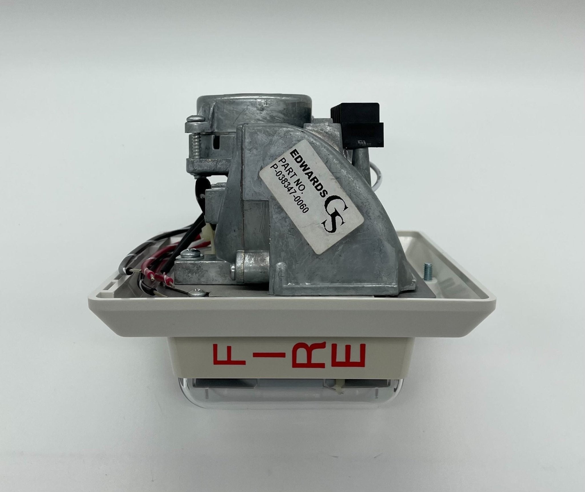 Edwards 757-7A-RS70W speaker strobe light with yellow housing and mounting bracket, designed for fire alarm signaling.