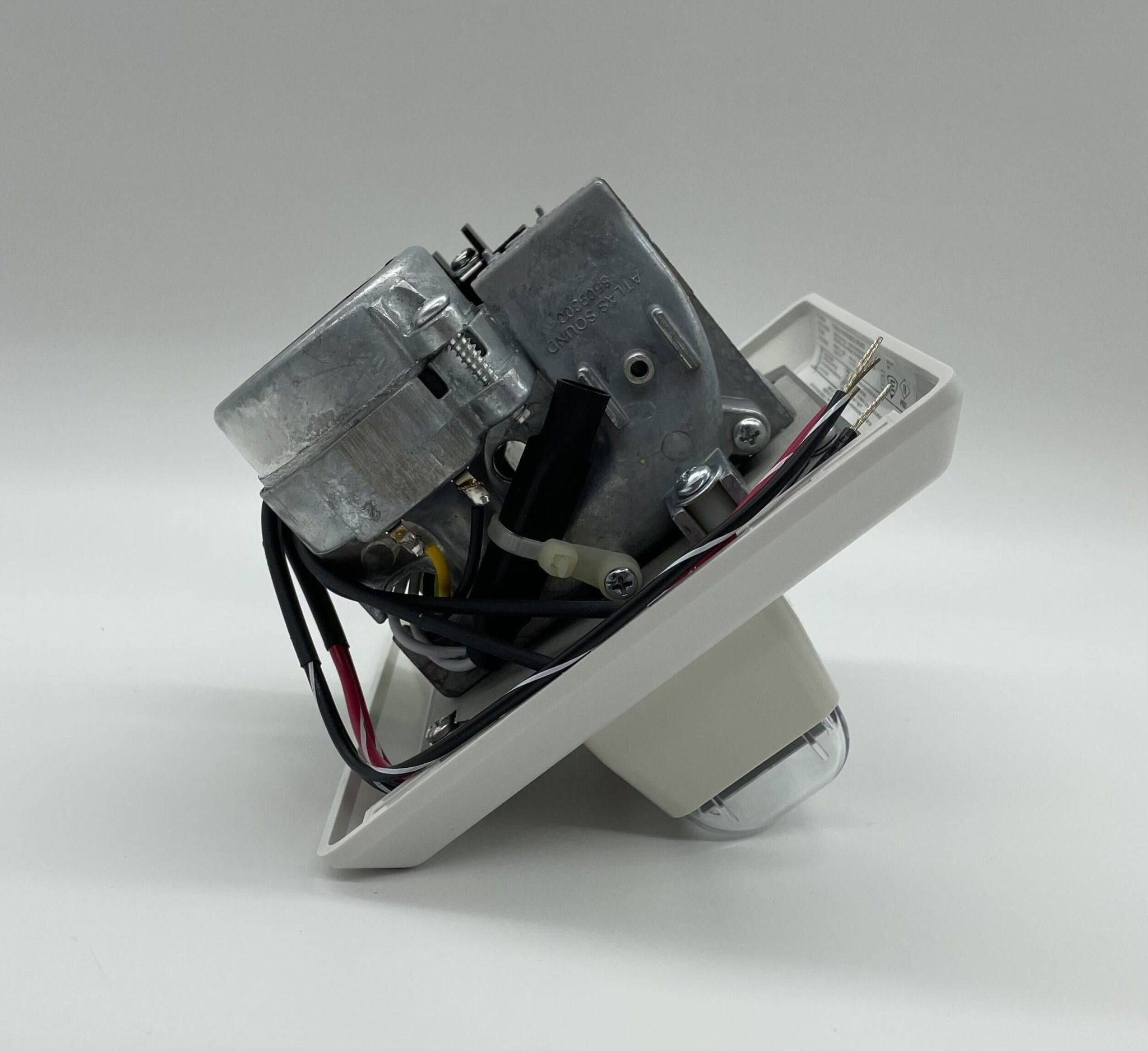 Edwards 757-7A-RS70W speaker strobe with white housing and red lens, mounted on a wall for fire alarm alert.