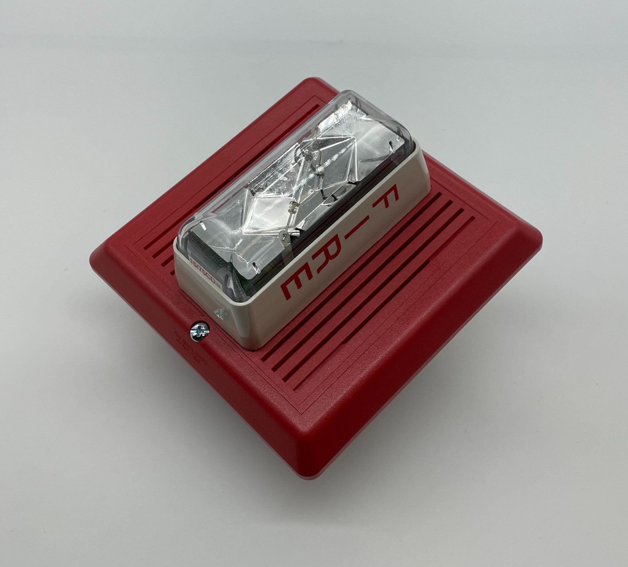 Edwards 757-7A-SS70 speaker strobe alarm with white housing and red lens for fire safety and alert signaling.
