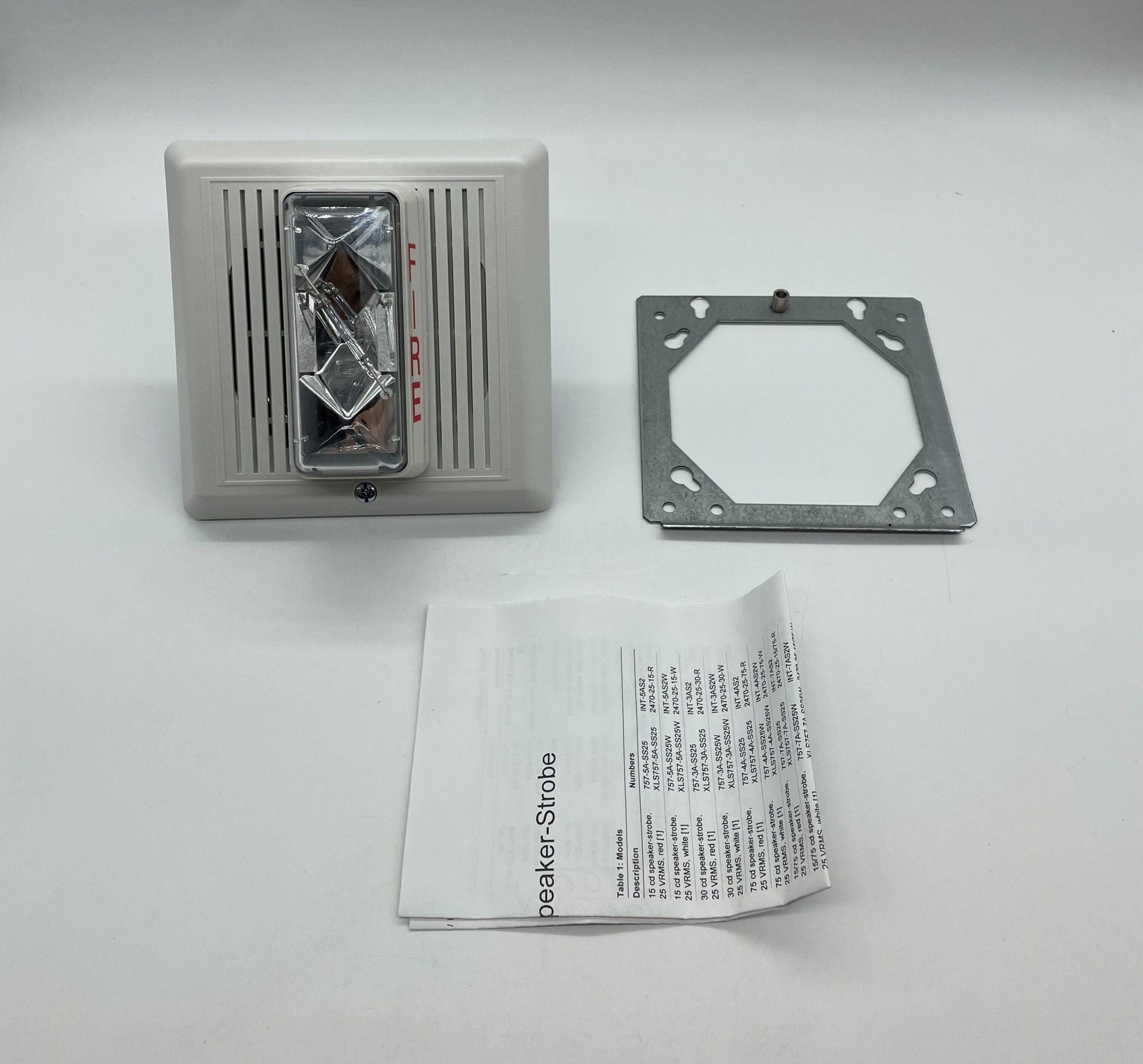 Edwards 757-7A-SS70W speaker strobe light mounted on a ceiling, showcasing its white enclosure and flashing light lens.