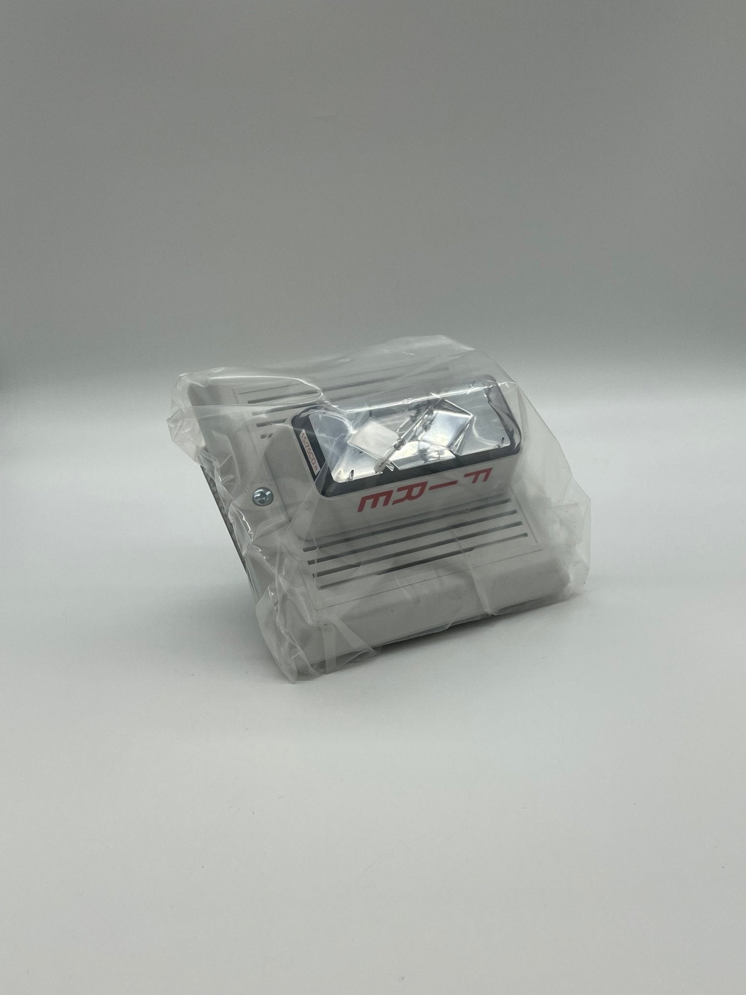 Edwards 757-7A-TW horn strobe alarm device with red housing and mounting bracket, designed for emergency notification systems.