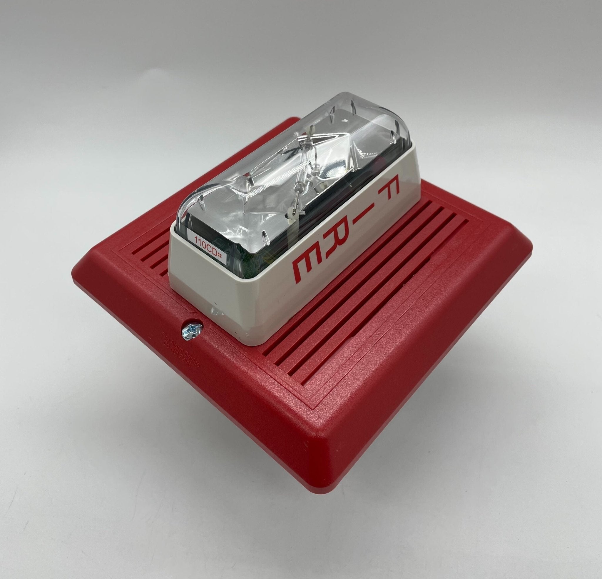 Edwards 757-8A-RS25 speaker strobe light with red lens, mounted on a ceiling, for fire alarm notification.