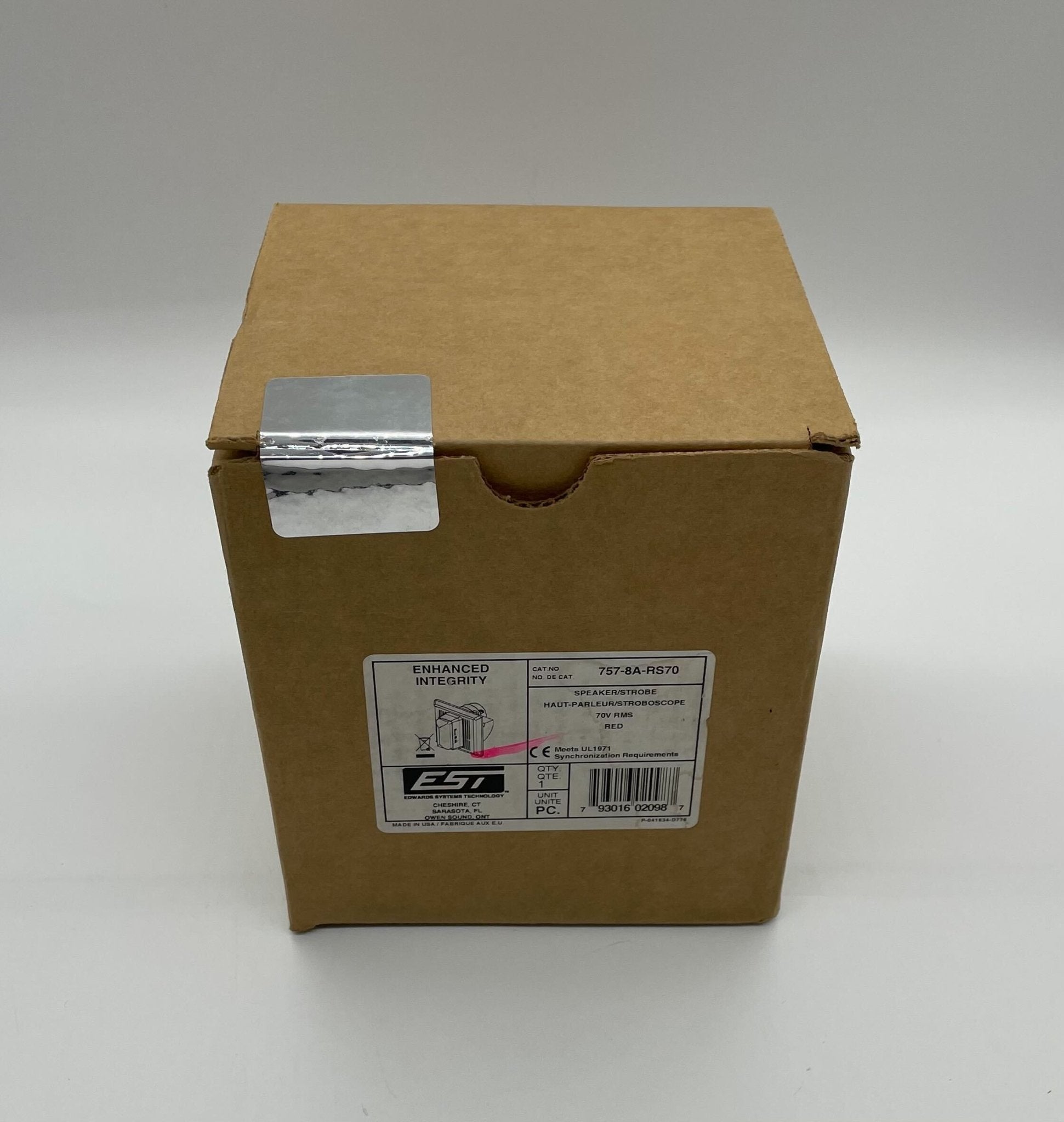 Edwards 757-8A-RS70 speaker strobe with red housing and clear lens, mounted on wall for fire alarm notification.