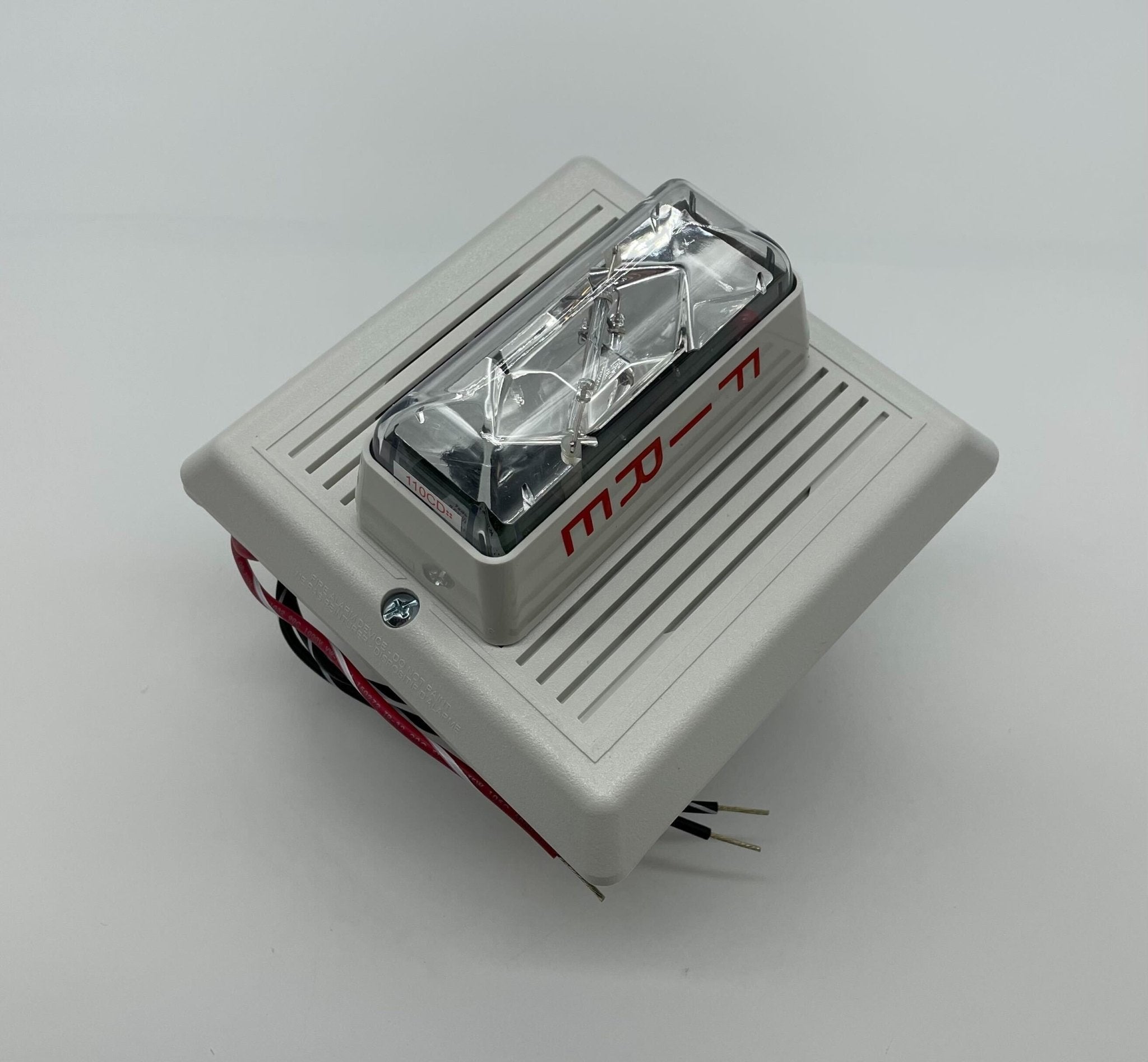 Edwards 757-8A-RS70W speaker strobe light with white housing and mounting bracket, designed for emergency alarm signaling.