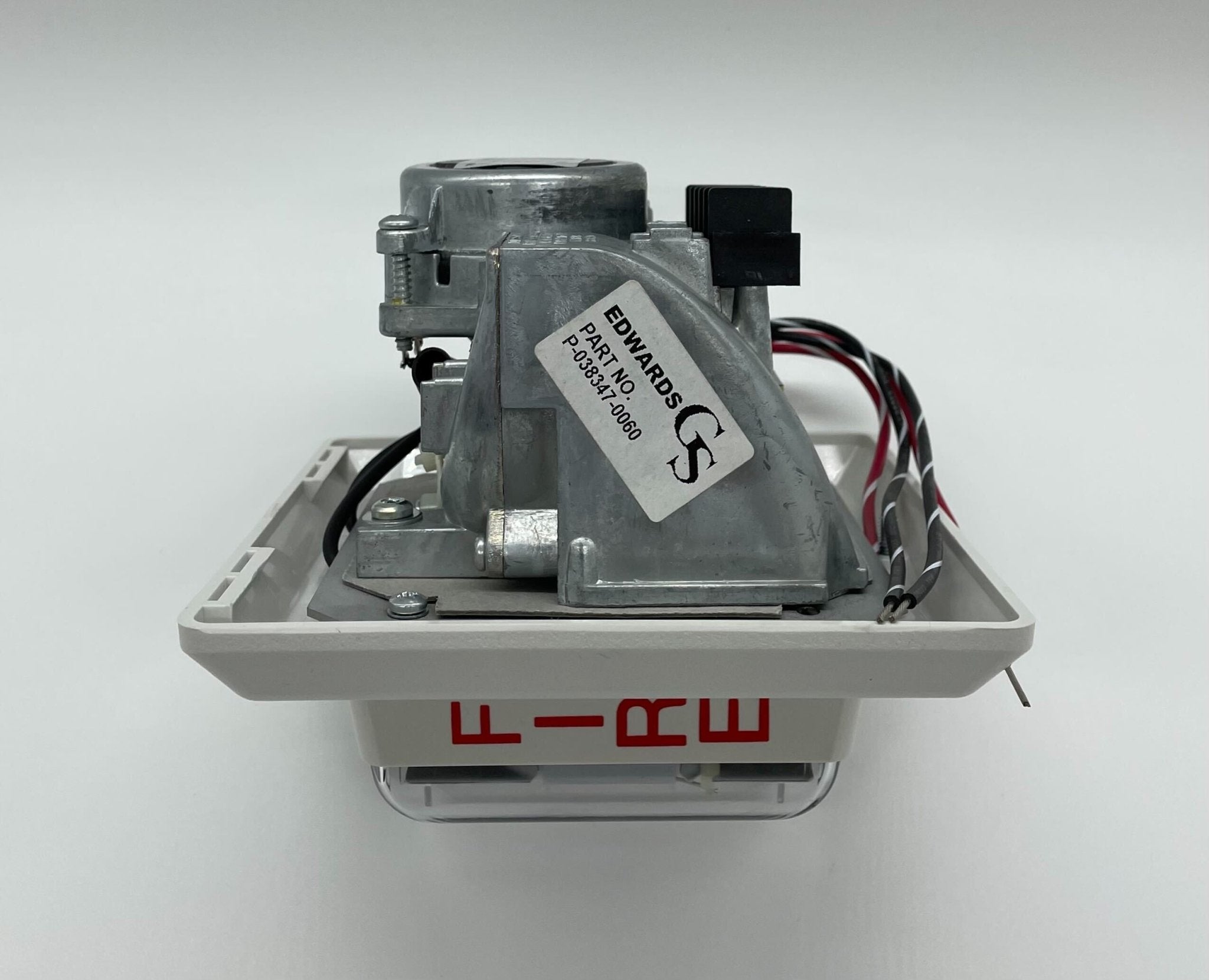 Edwards 757-8A-RS70W speaker strobe alarm with bright flashing light and siren, mounted on a wall for emergency alerts.