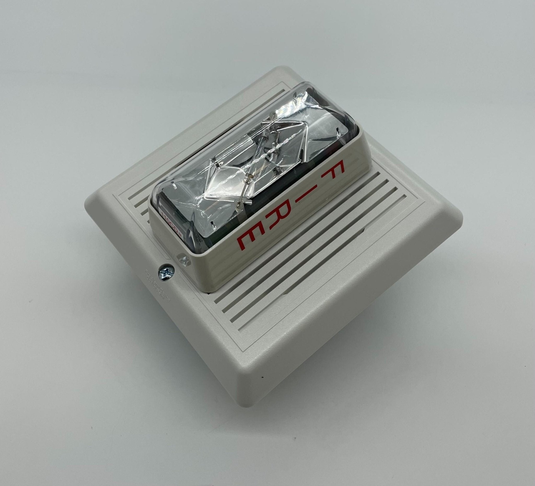 Edwards 757-8A-SS25W speaker strobe light with white housing, visible speaker grille and mounting components.