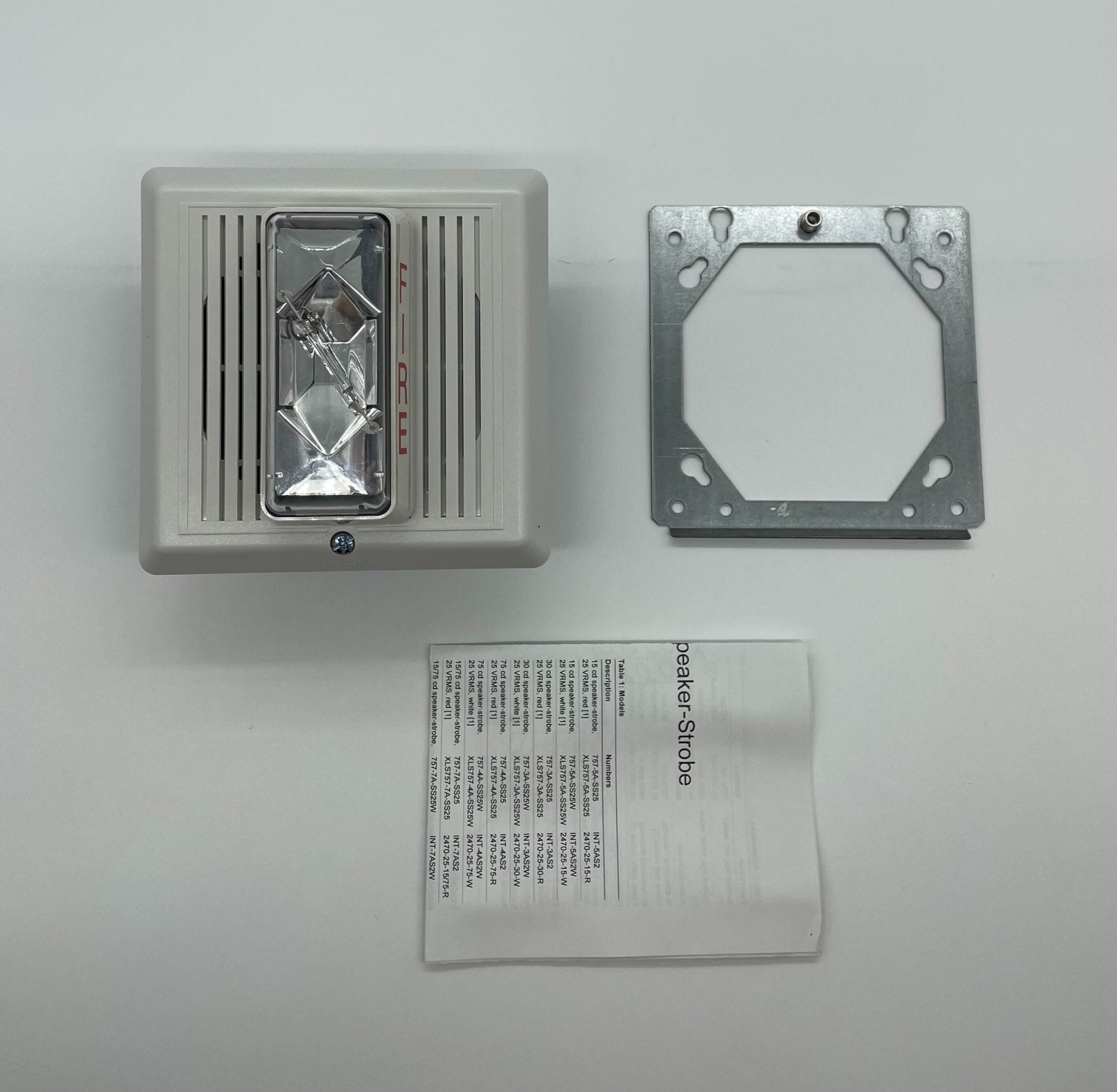 Edwards 757-8A-SS25W speaker strobe light mounted on a ceiling, featuring a white housing and visible mounting hardware.