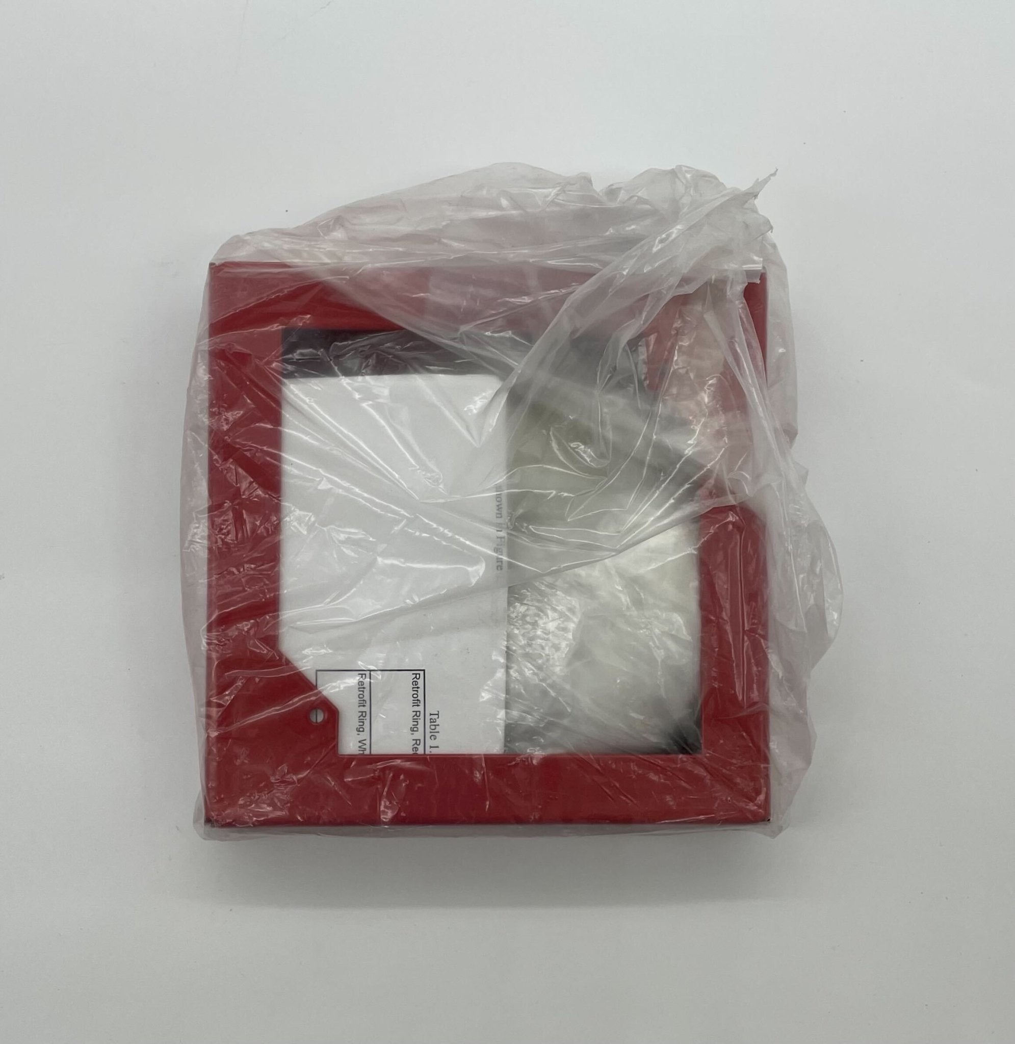 Edwards 757A-RR fire alarm with red and white sensor, mounted on a wall for fire detection and safety.
